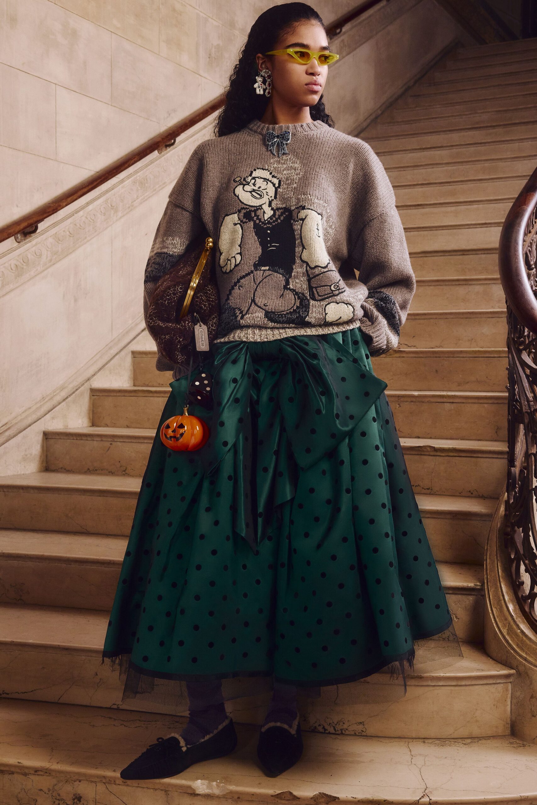 gray sweater green polka-dot skirt