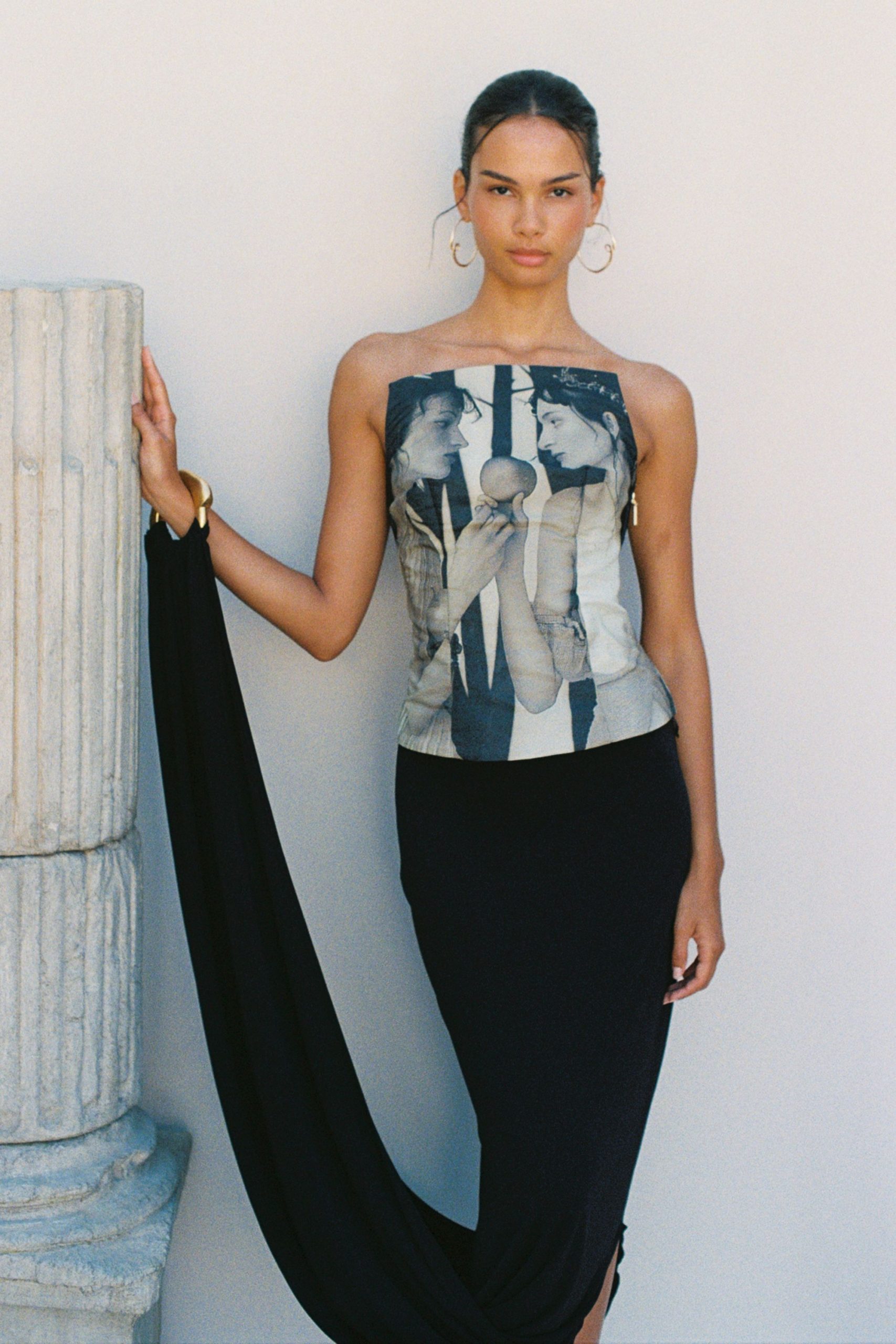 multi-colored fitted top with black skirt