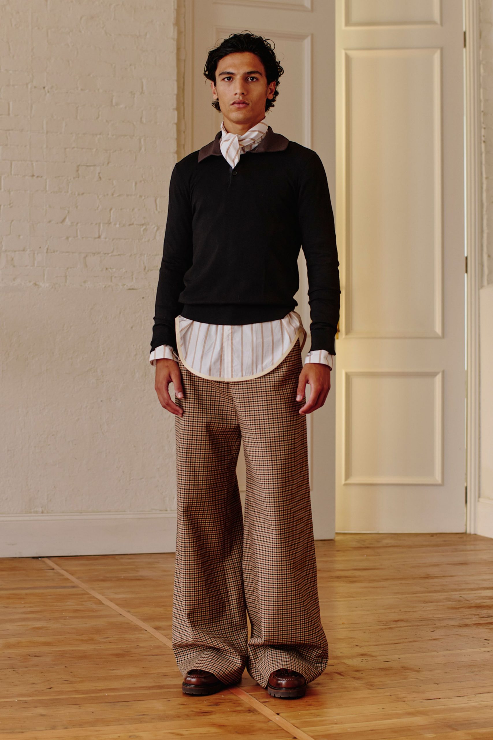 black sweater white shirt brown pants