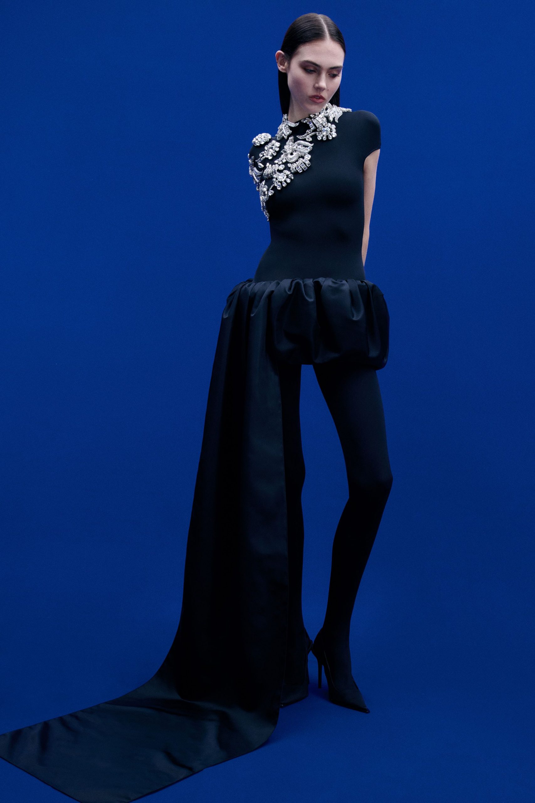 black silk catsuit with asymmetric skirt