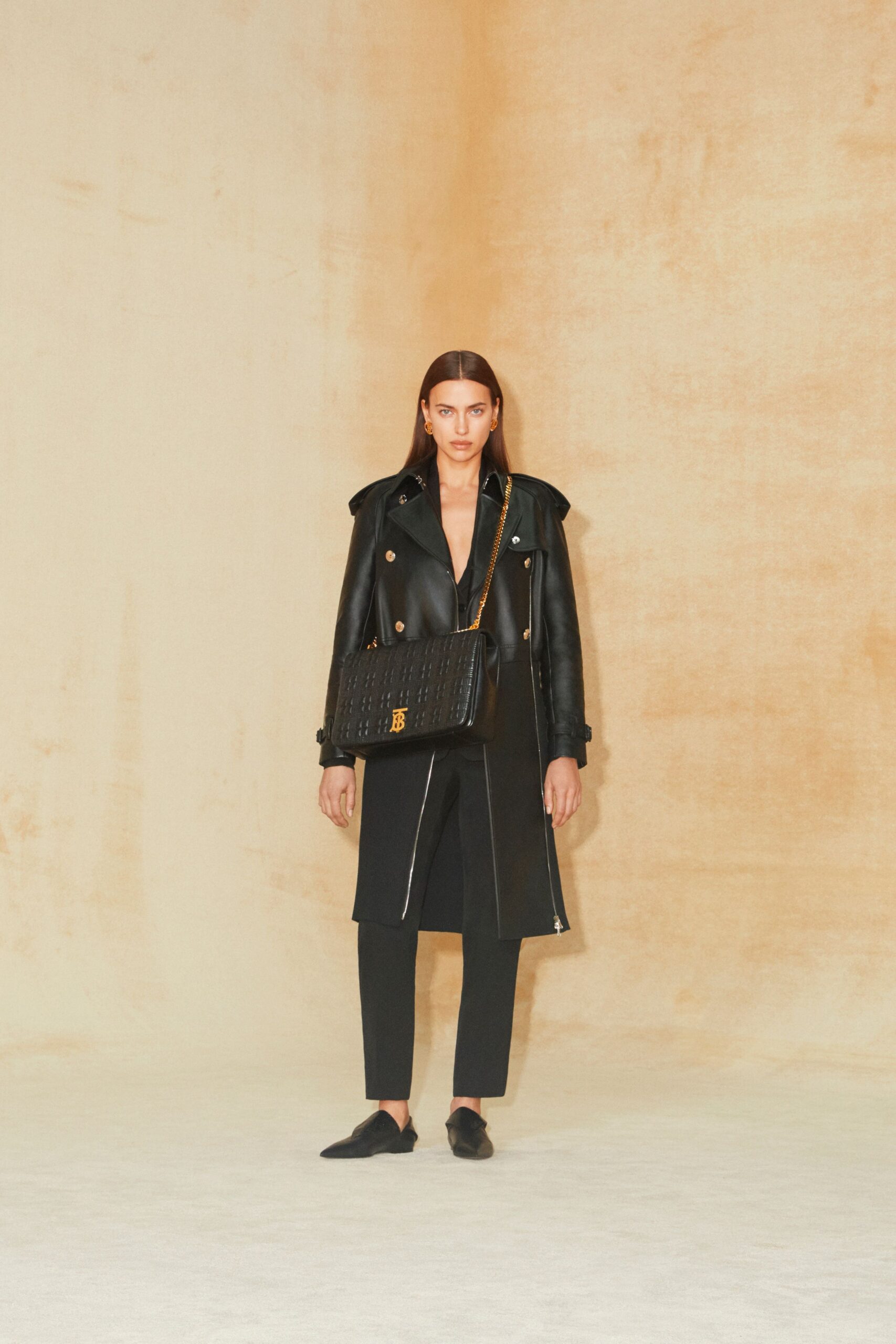 black leather long-sleeve collared structured buttoned zippered jacket