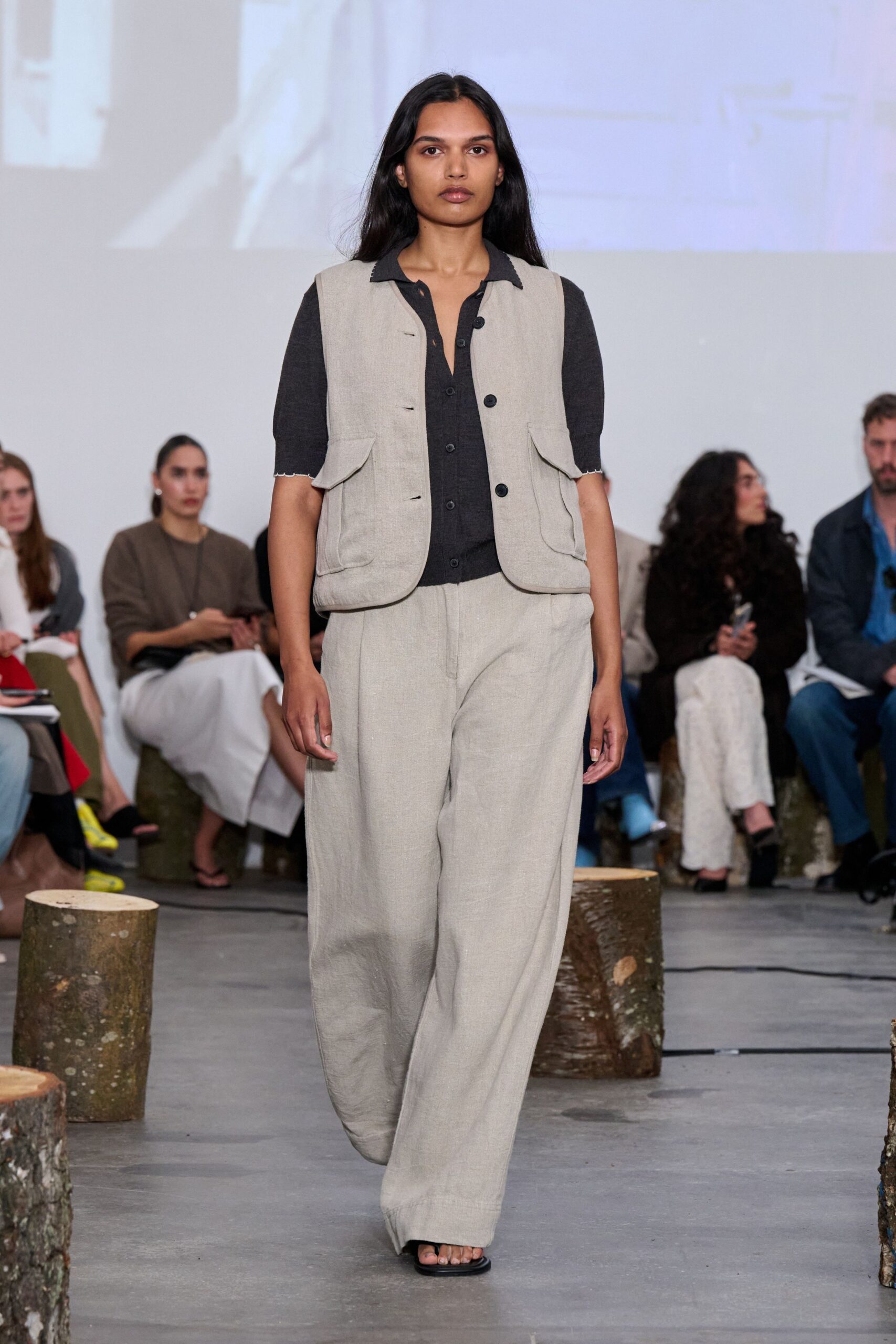 beige linen vest with black shirt