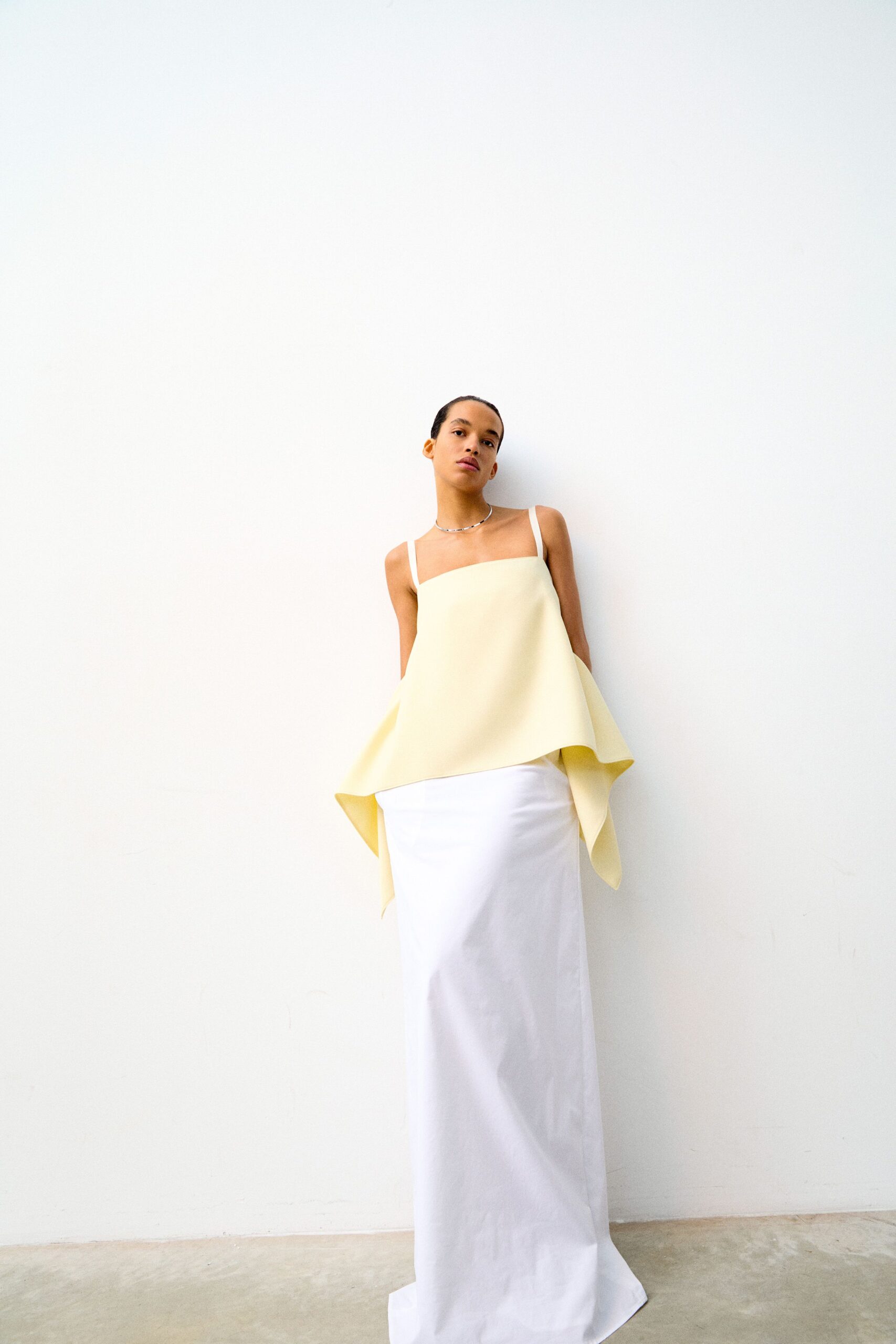 yellow asymmetric top white maxi skirt
