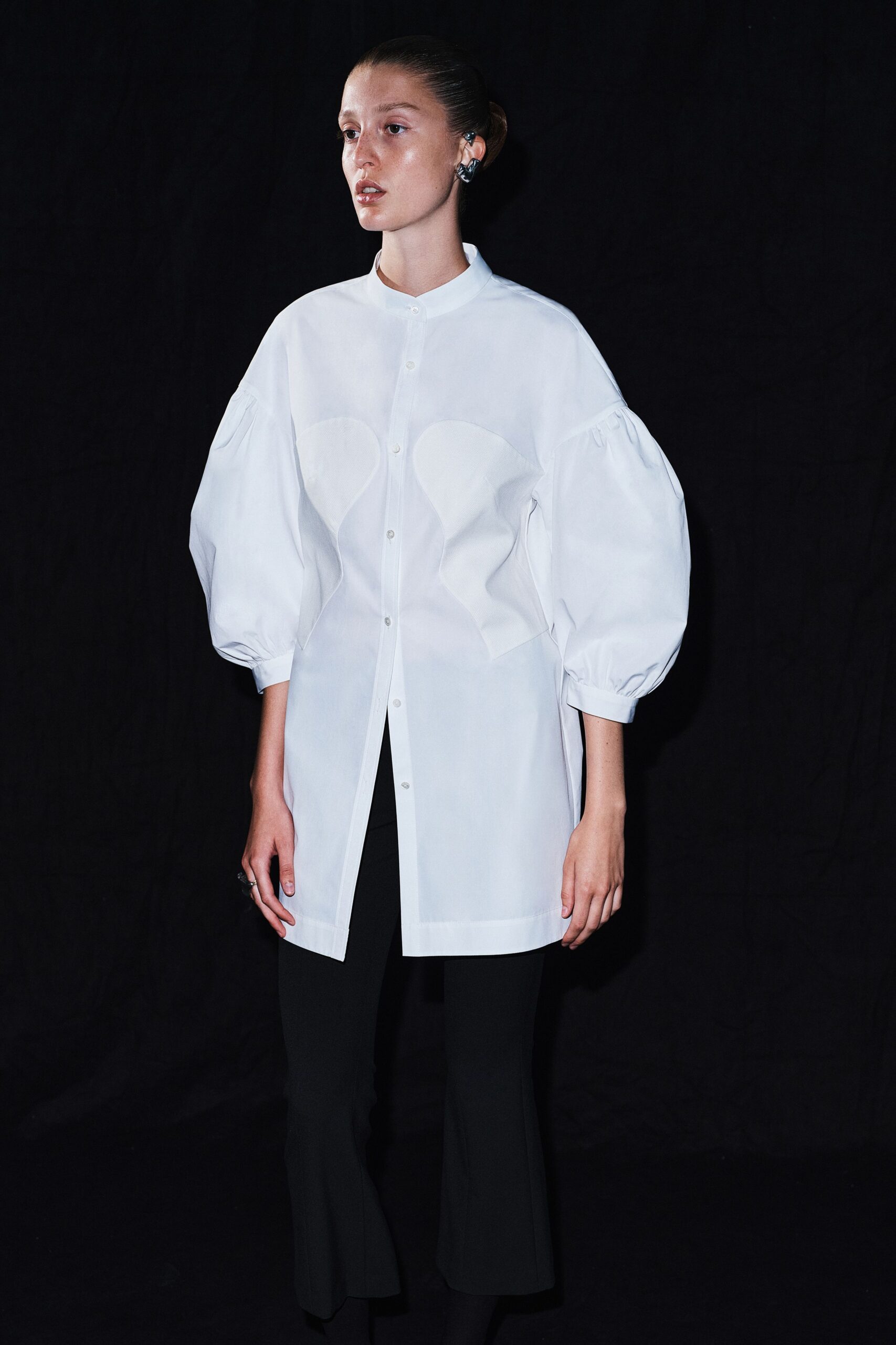 white relaxed shirt with flared pants