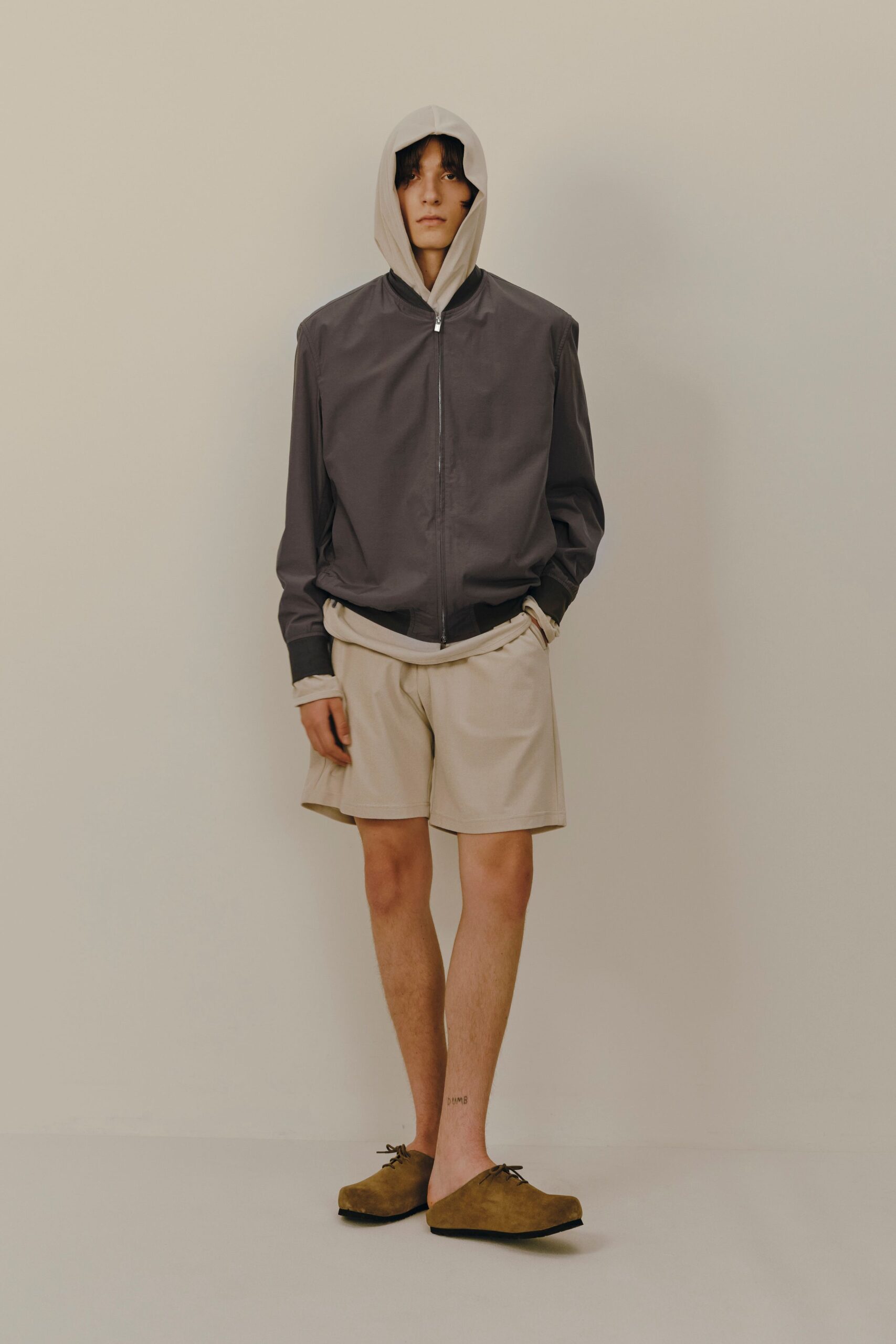 gray hooded jacket beige shorts