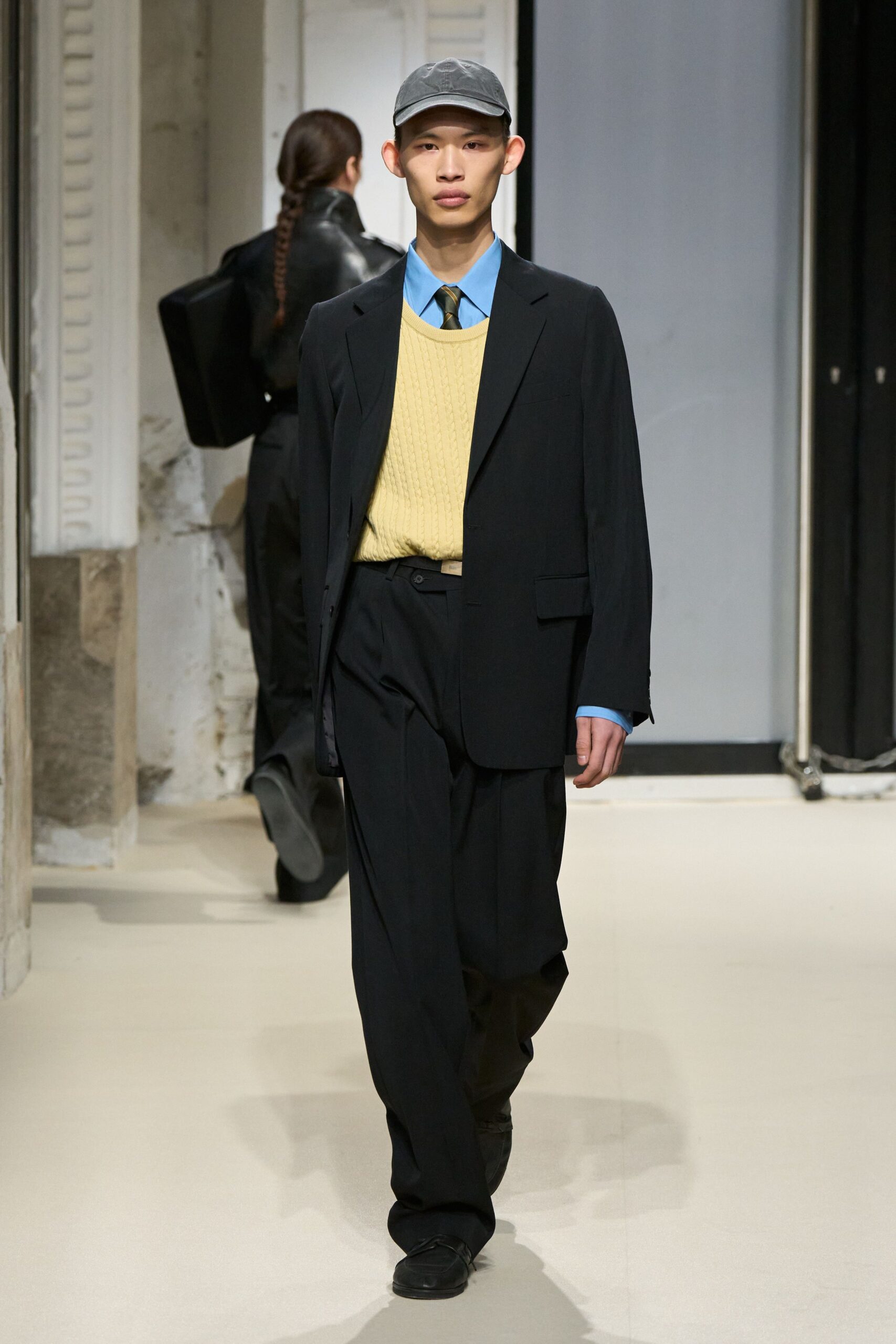 black tailored suit with yellow sweater
