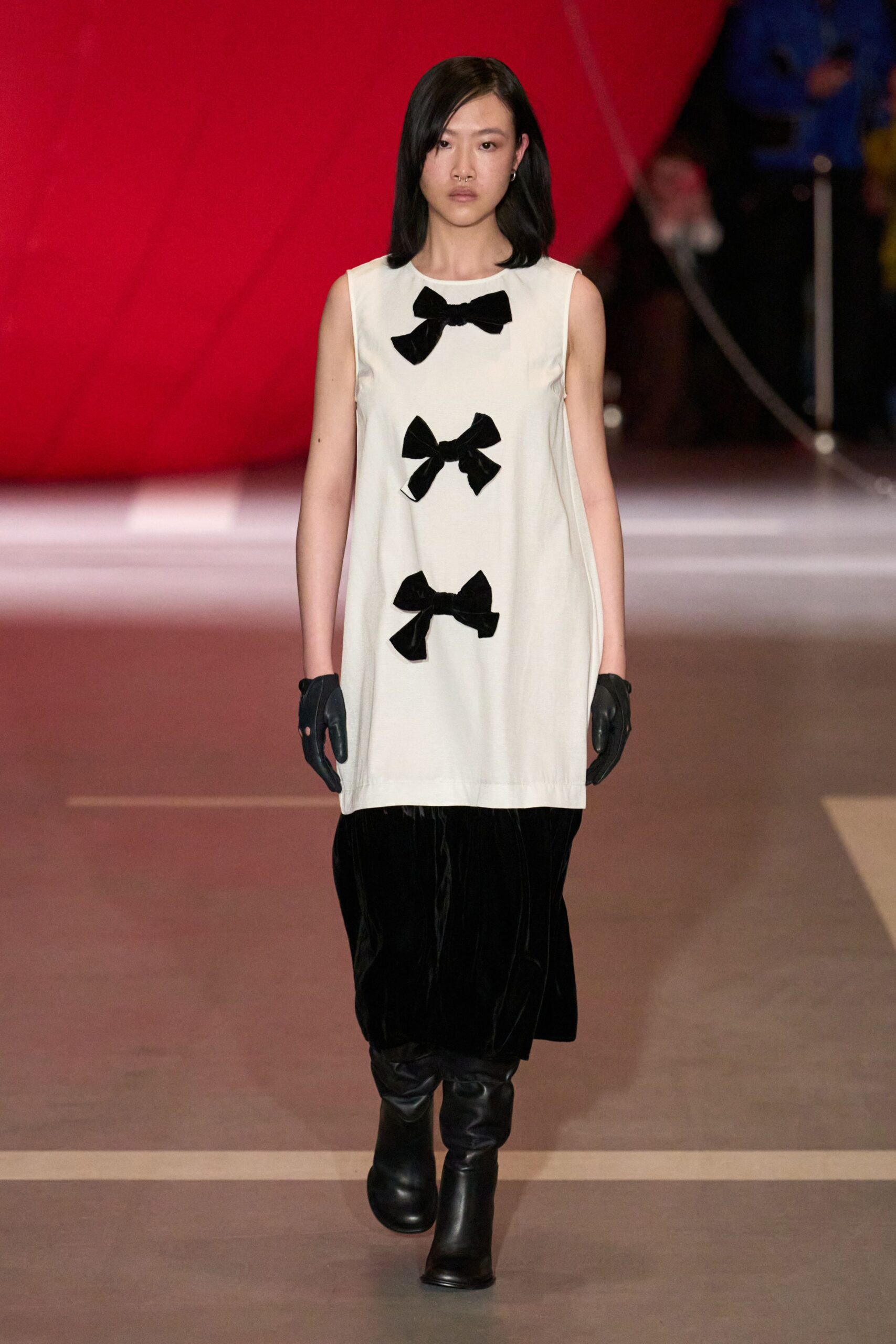 white and black midi dress with gloves and boots