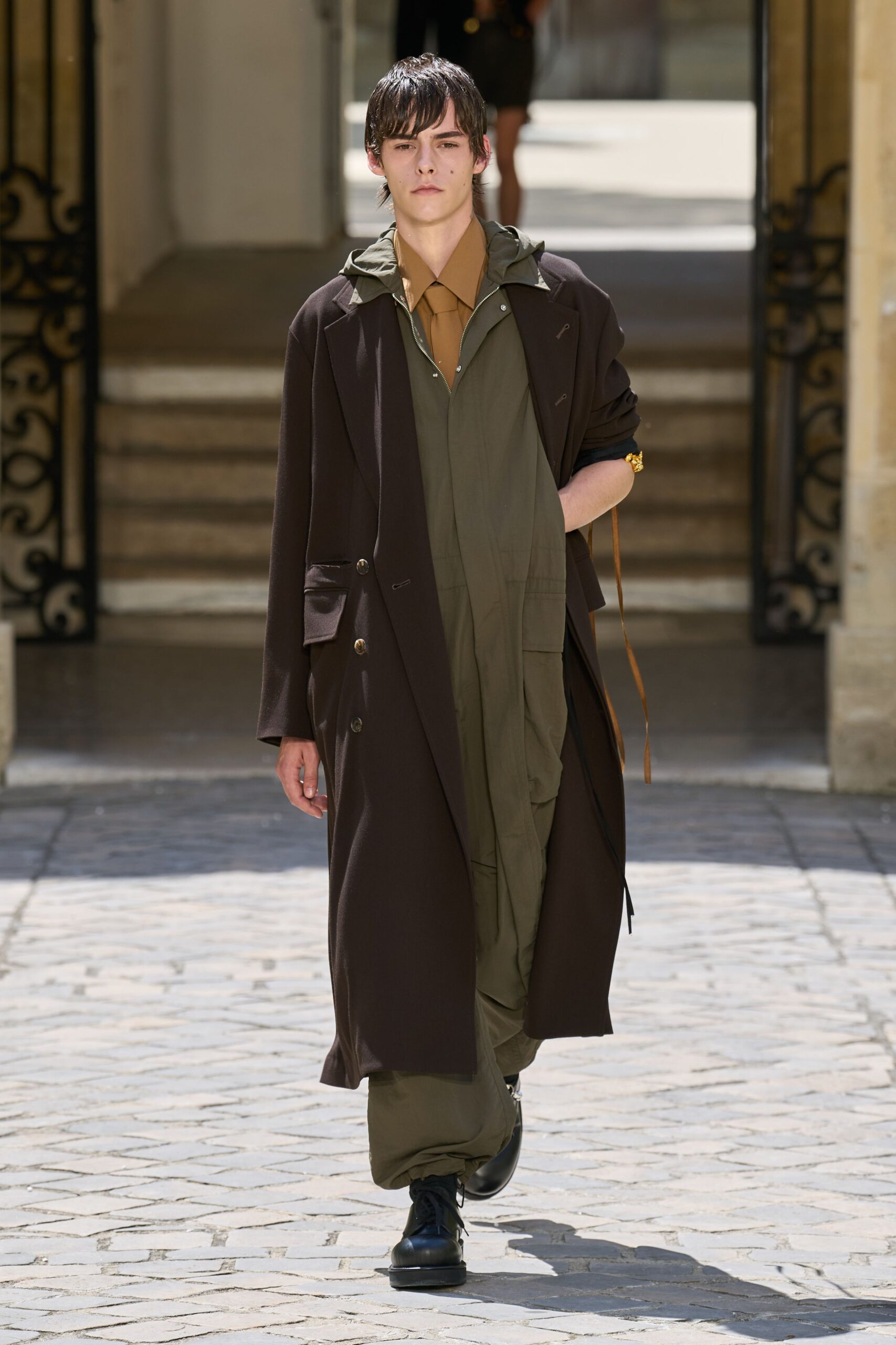 brown coat green jumpsuit