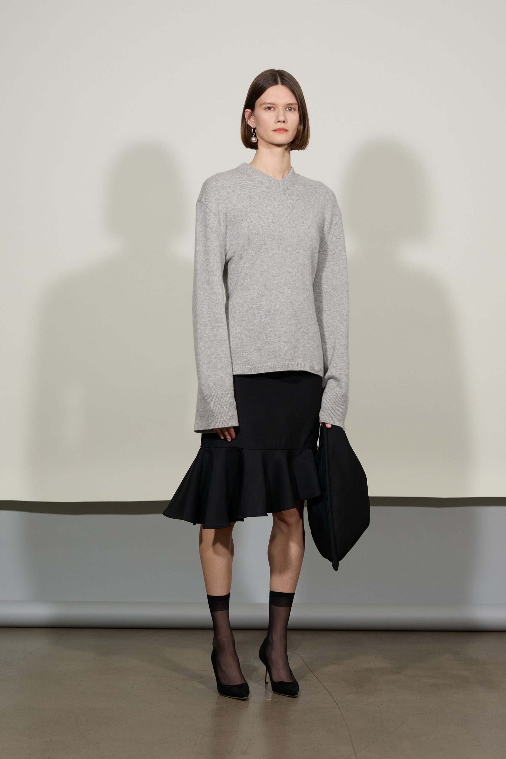 gray relaxed top with black skirt