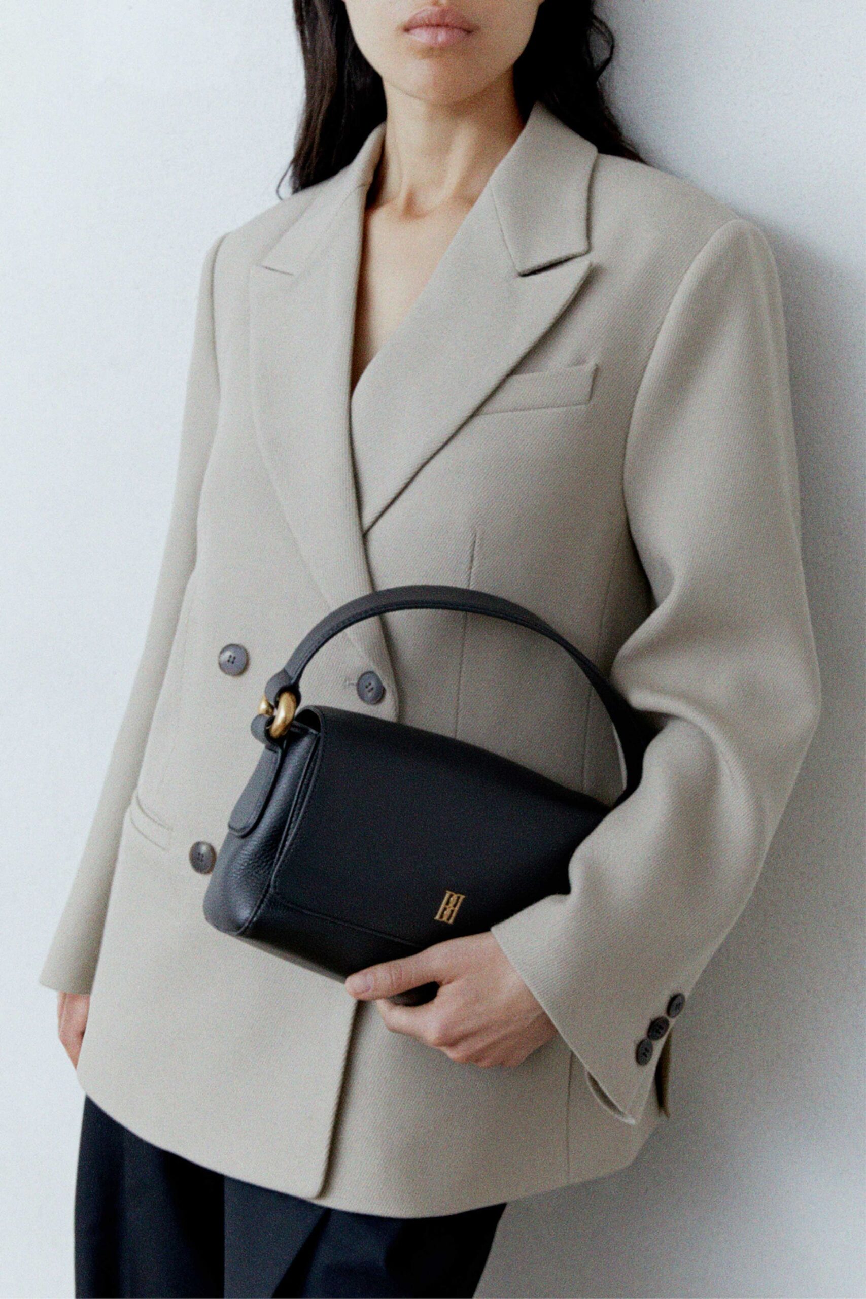 beige wool long-sleeve collared structured buttoned pockets blazer