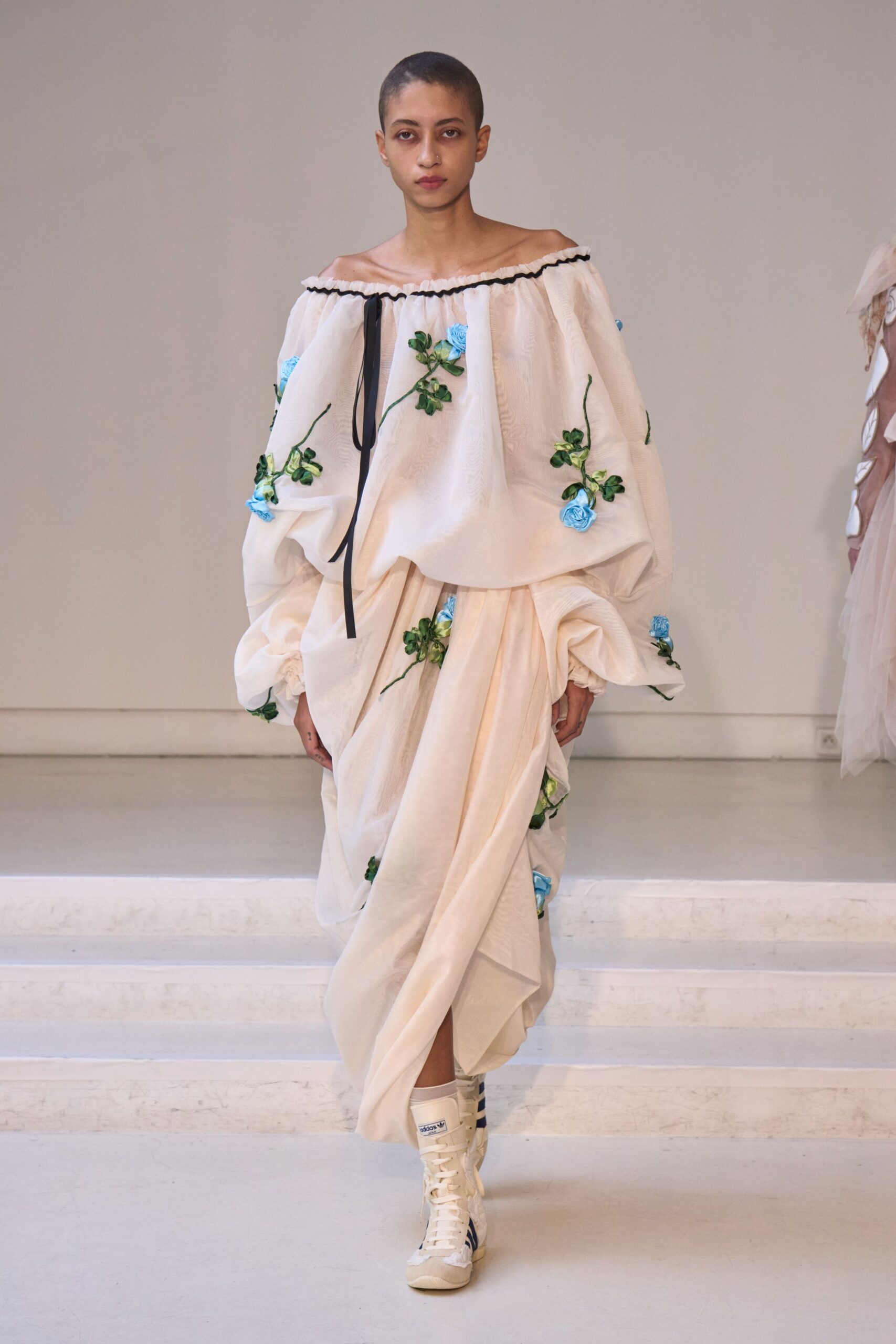 white embroidered blouse beige skirt