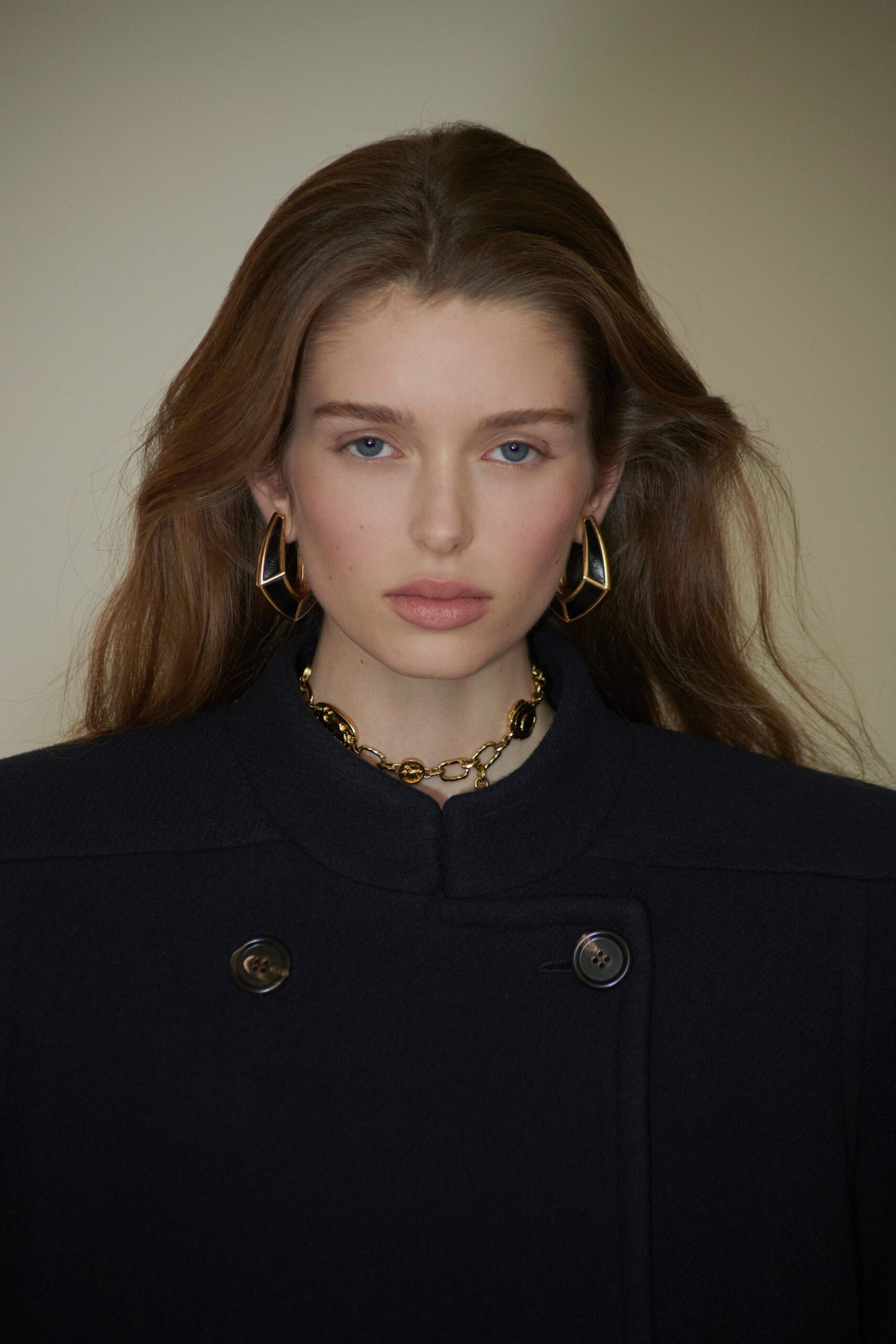 black wool long-sleeve collared structured buttoned midi coat