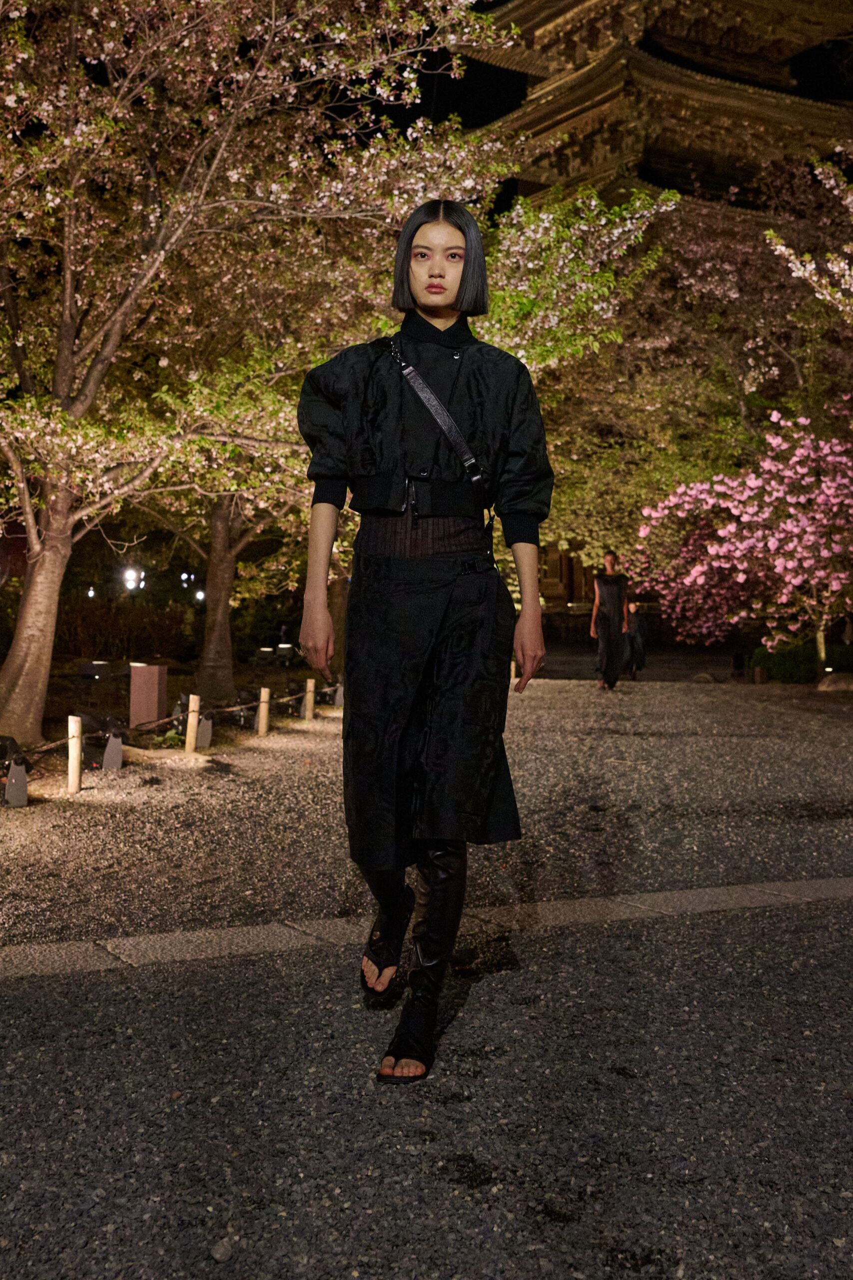 black fitted jacket and midi skirt