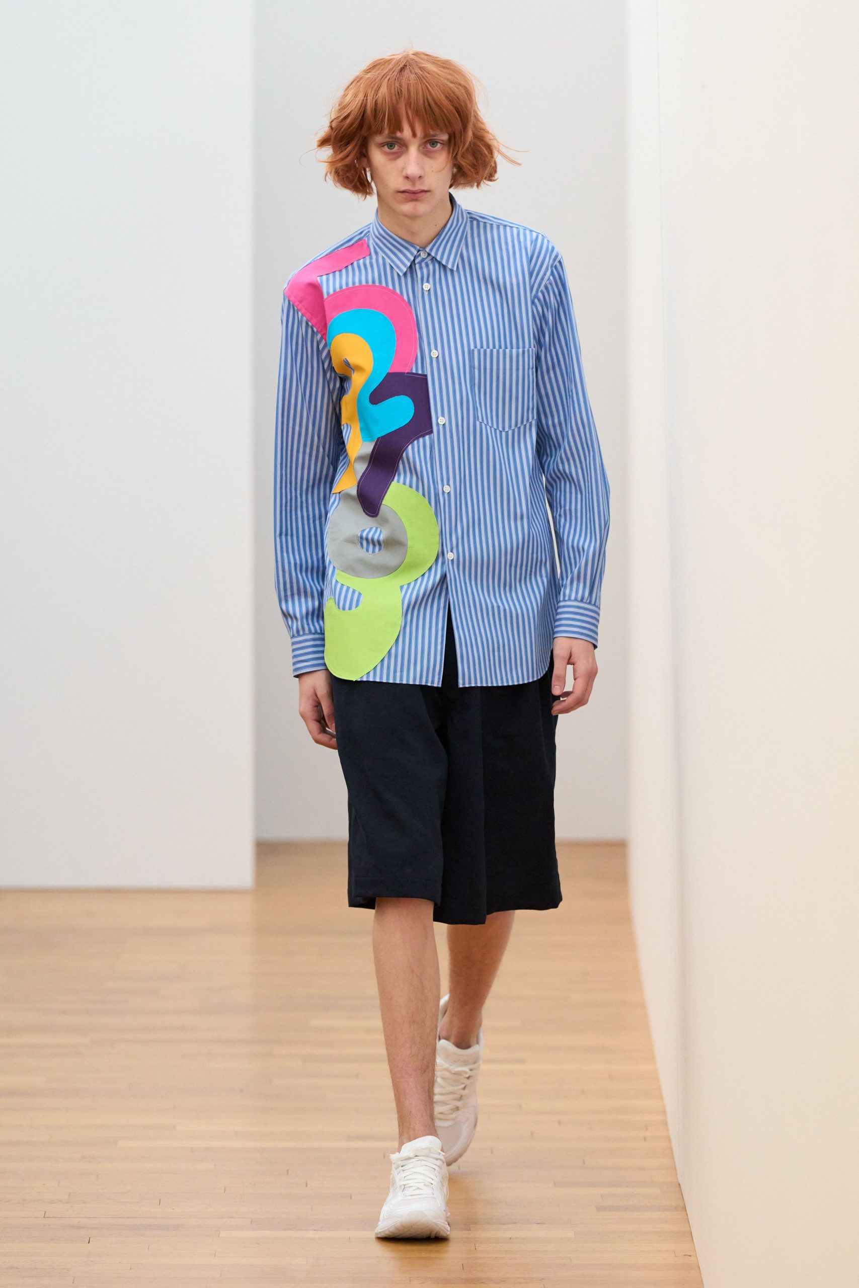 blue striped shirt with black shorts