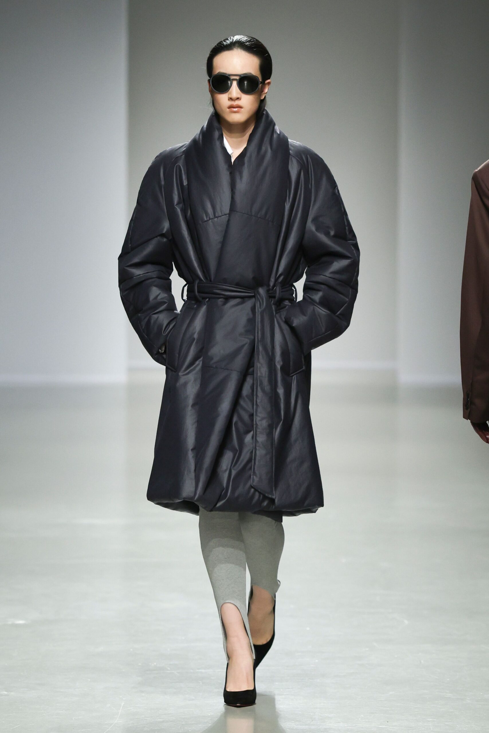 black vinyl long-sleeve collared relaxed belted shiny coat