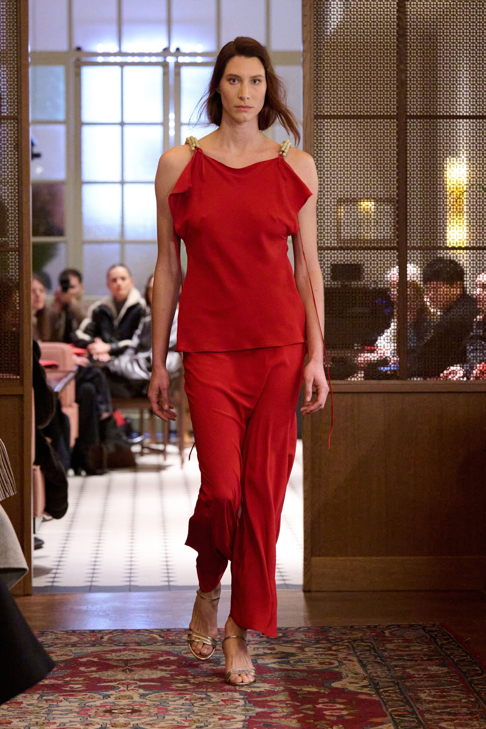red silk sleeveless off-shoulder fitted draped top