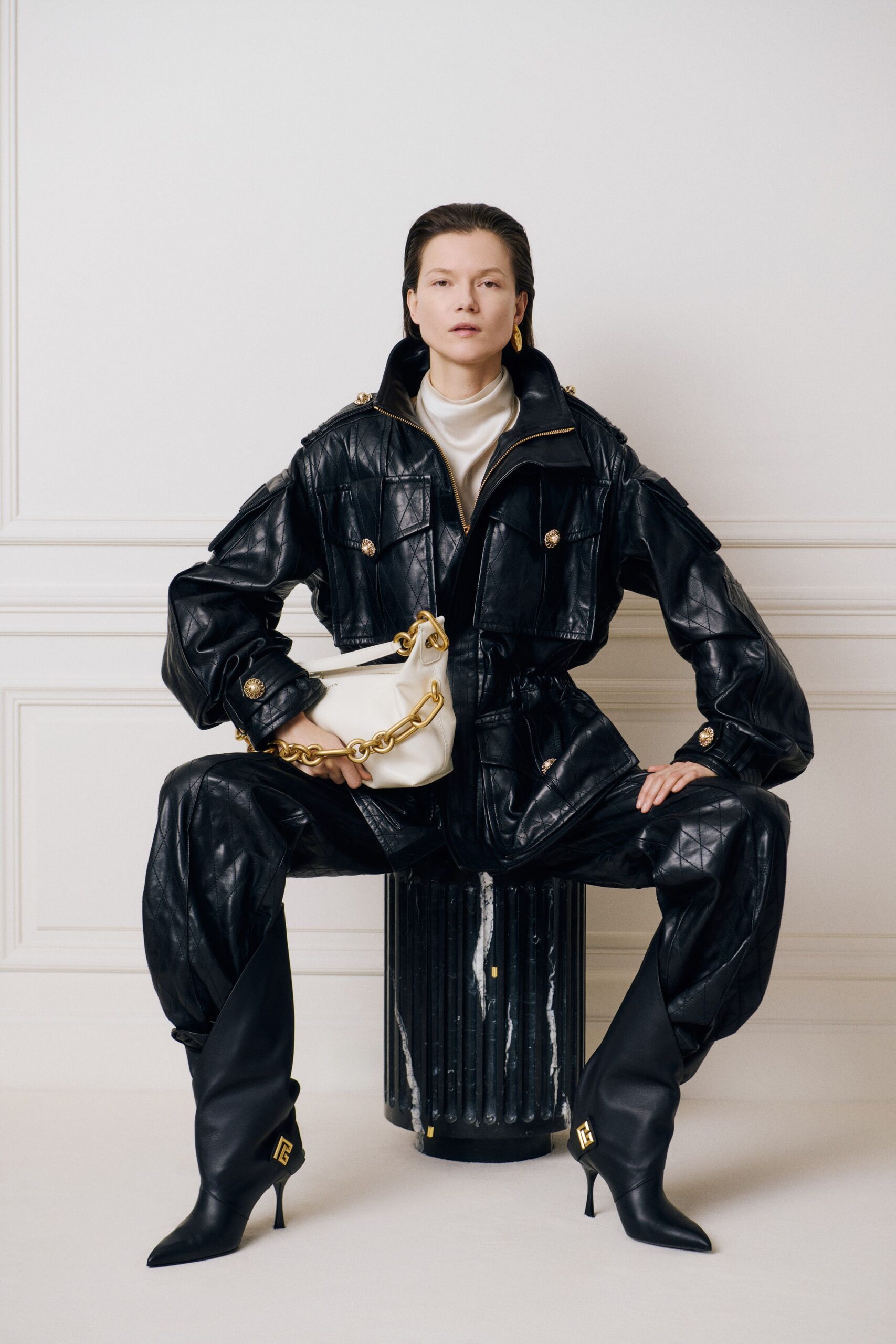 black leather long-sleeve collared fitted quilted zippered jumpsuit