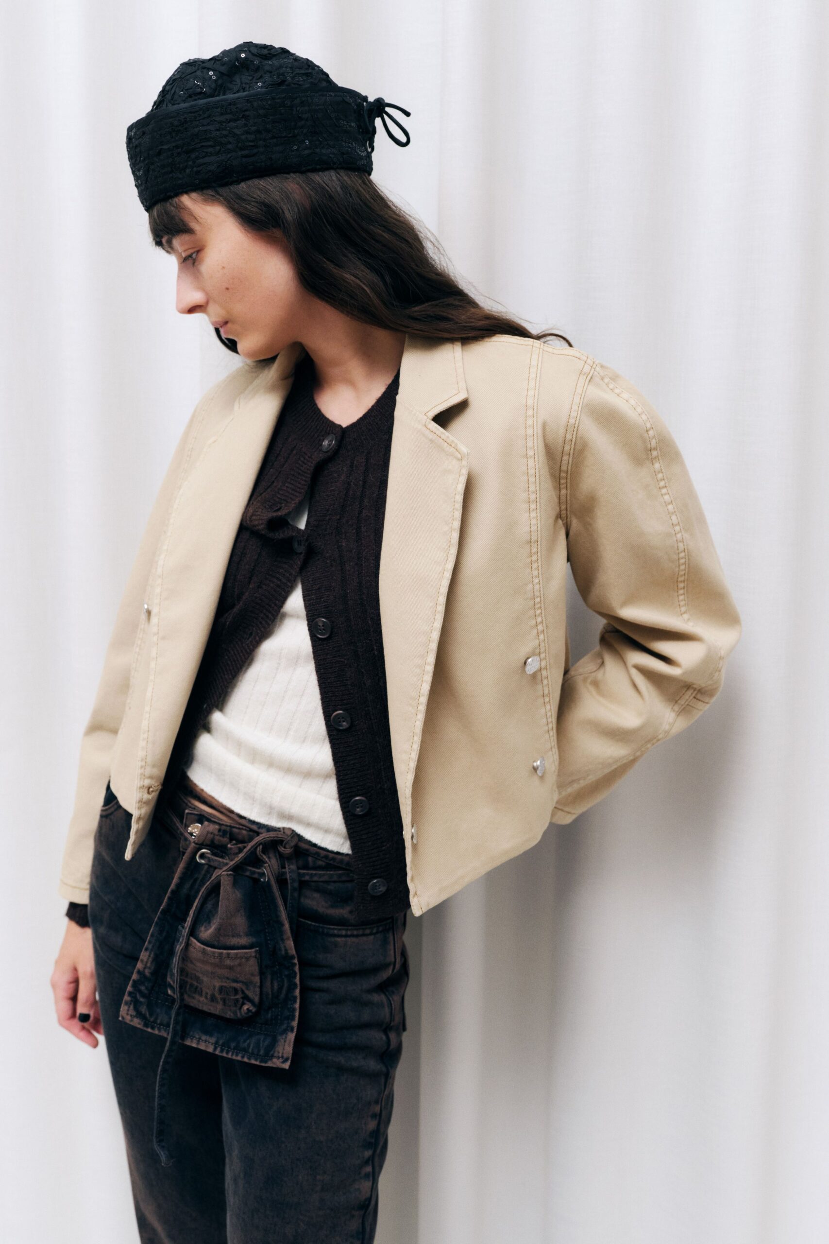 beige jacket brown cardigan black pants