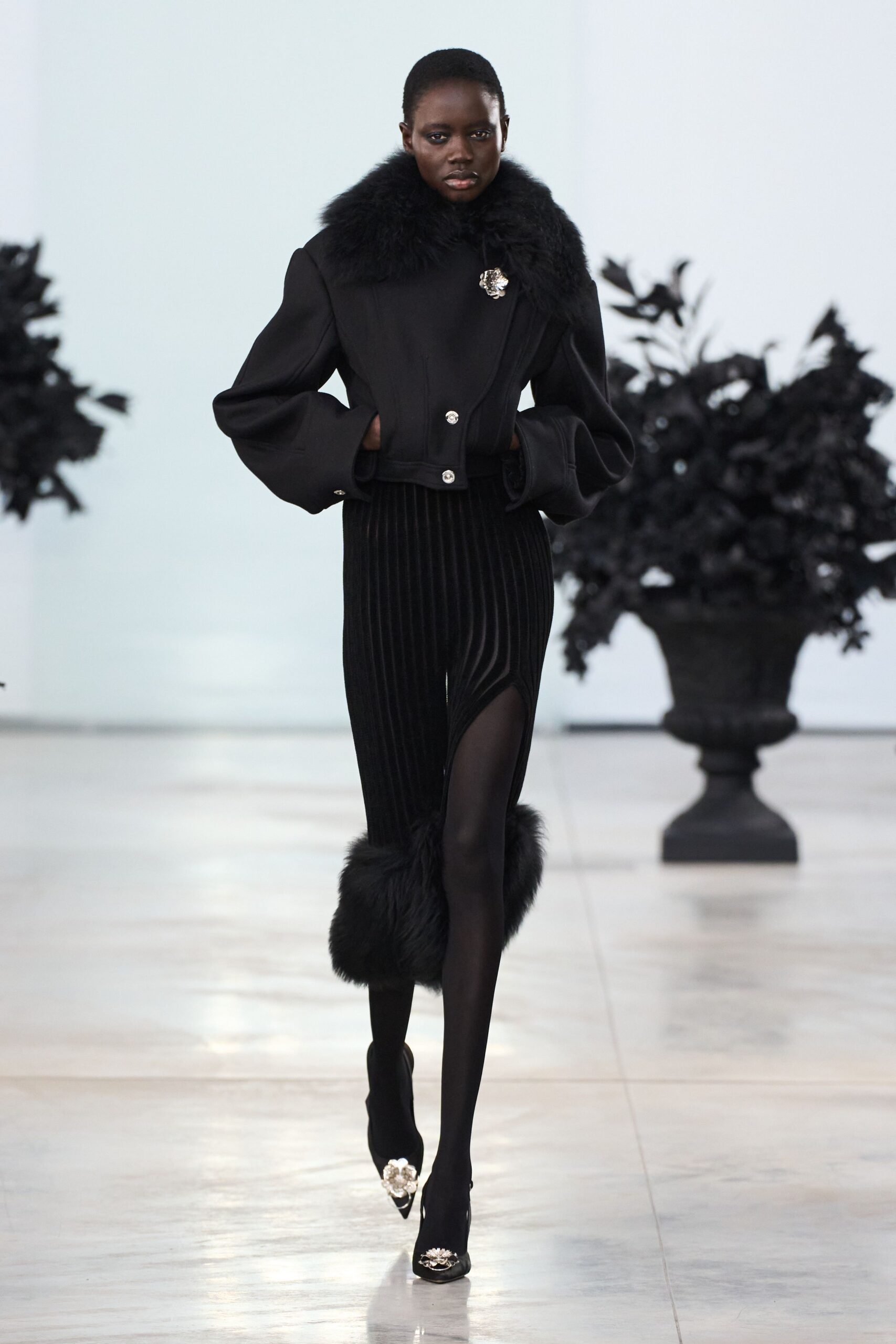 black structured jacket with fitted pants