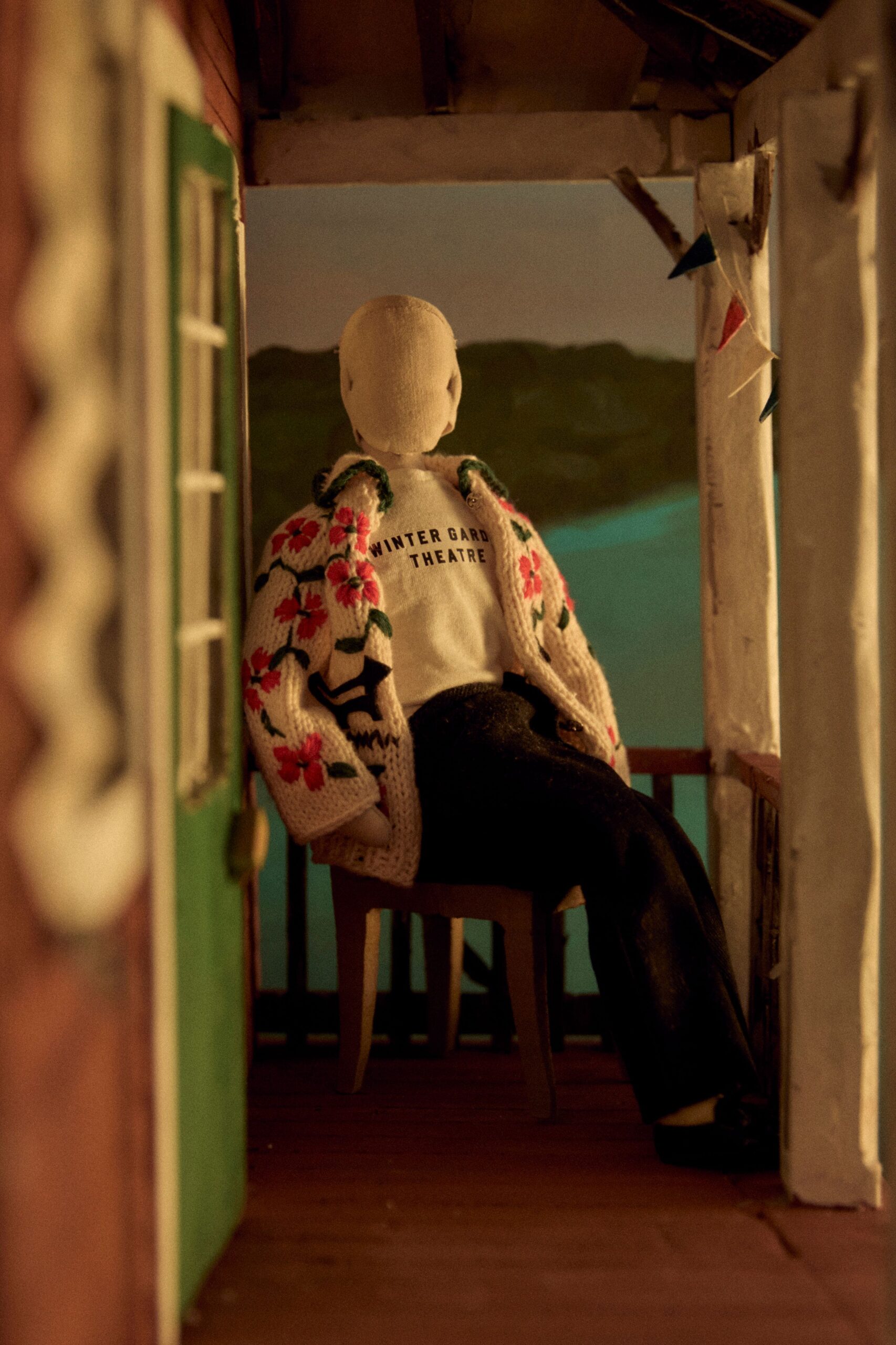embroidered sweater and black pants
