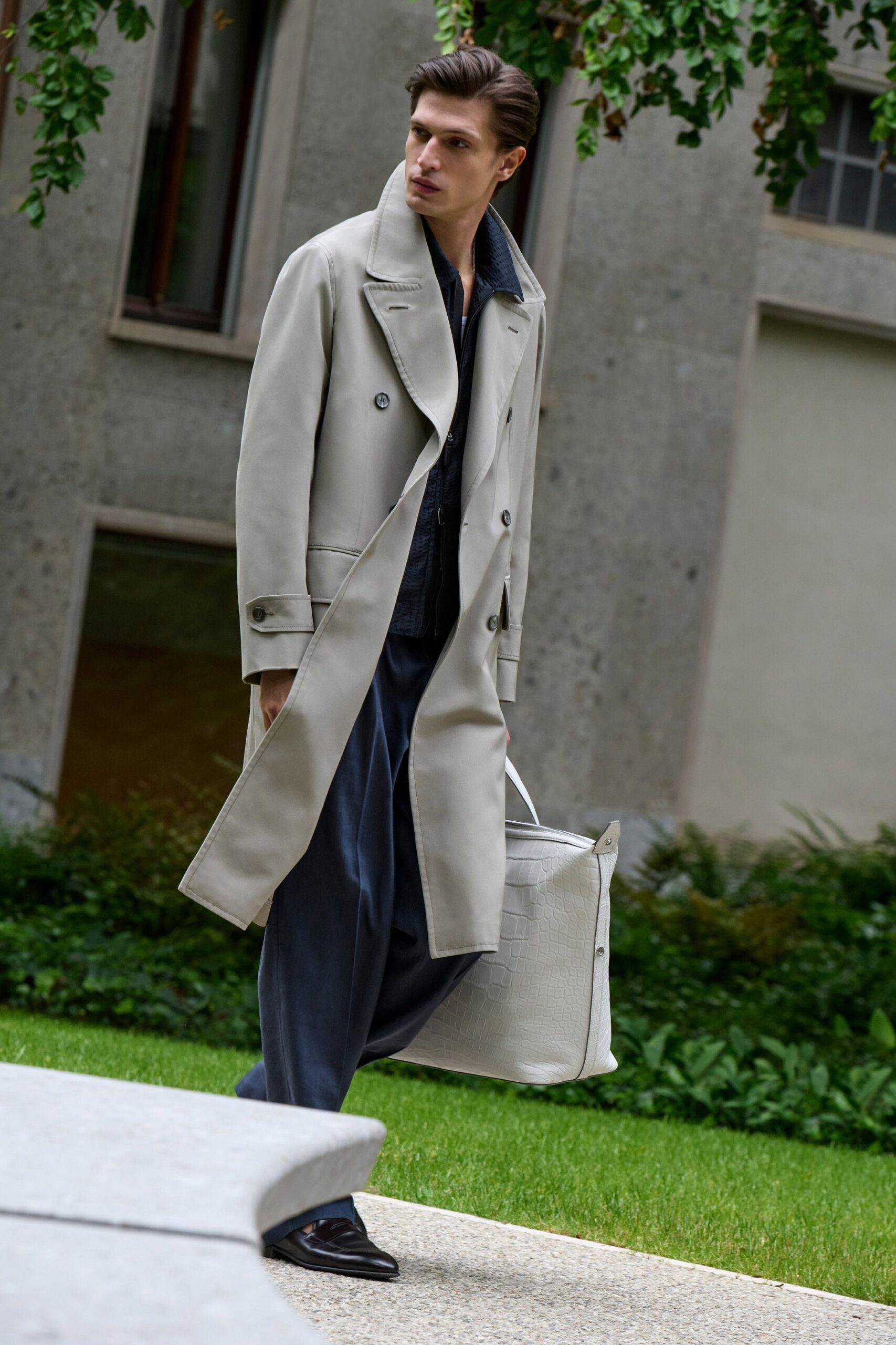 beige coat with blue pants