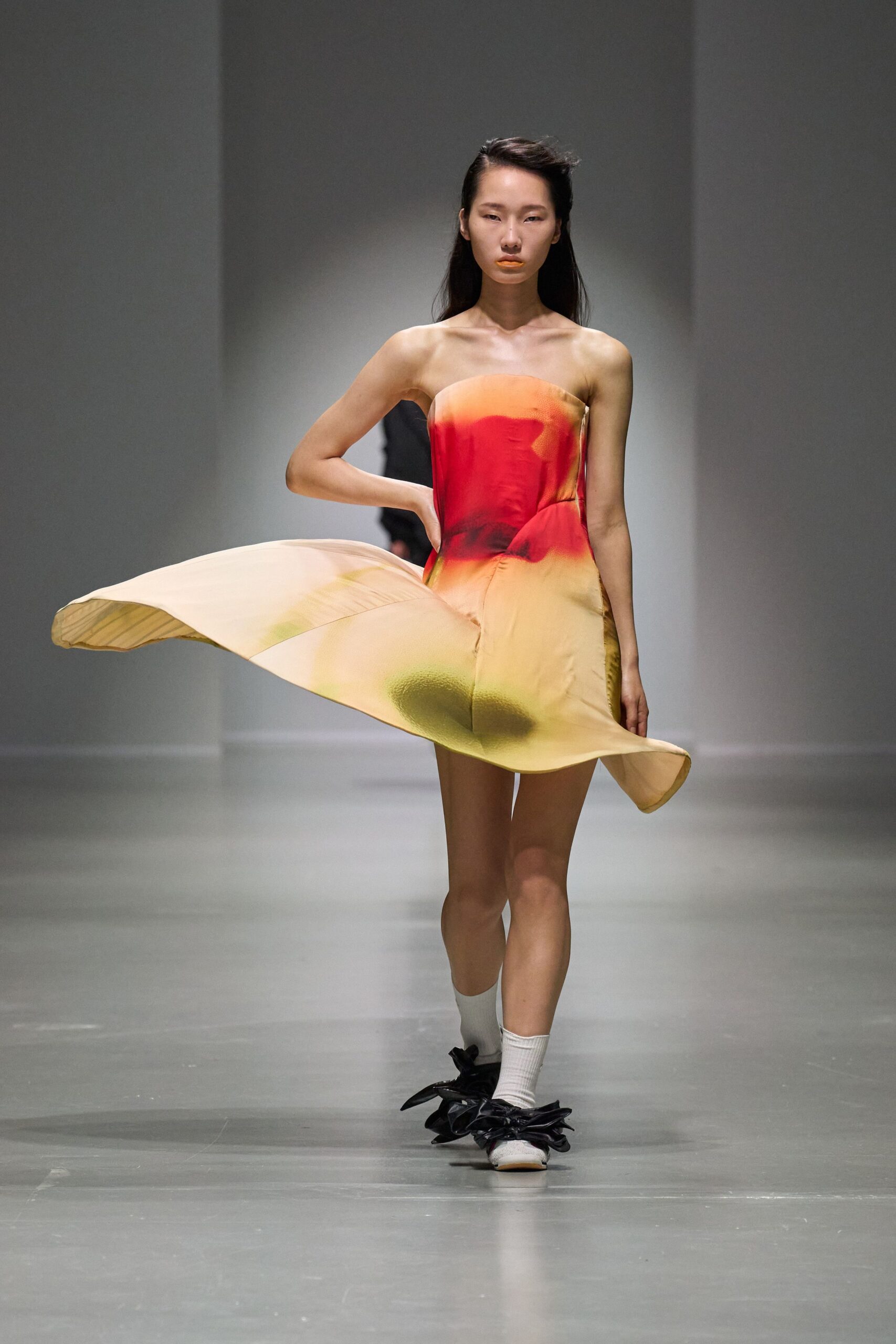 red silk sleeveless off-shoulder fitted draped flowing dress