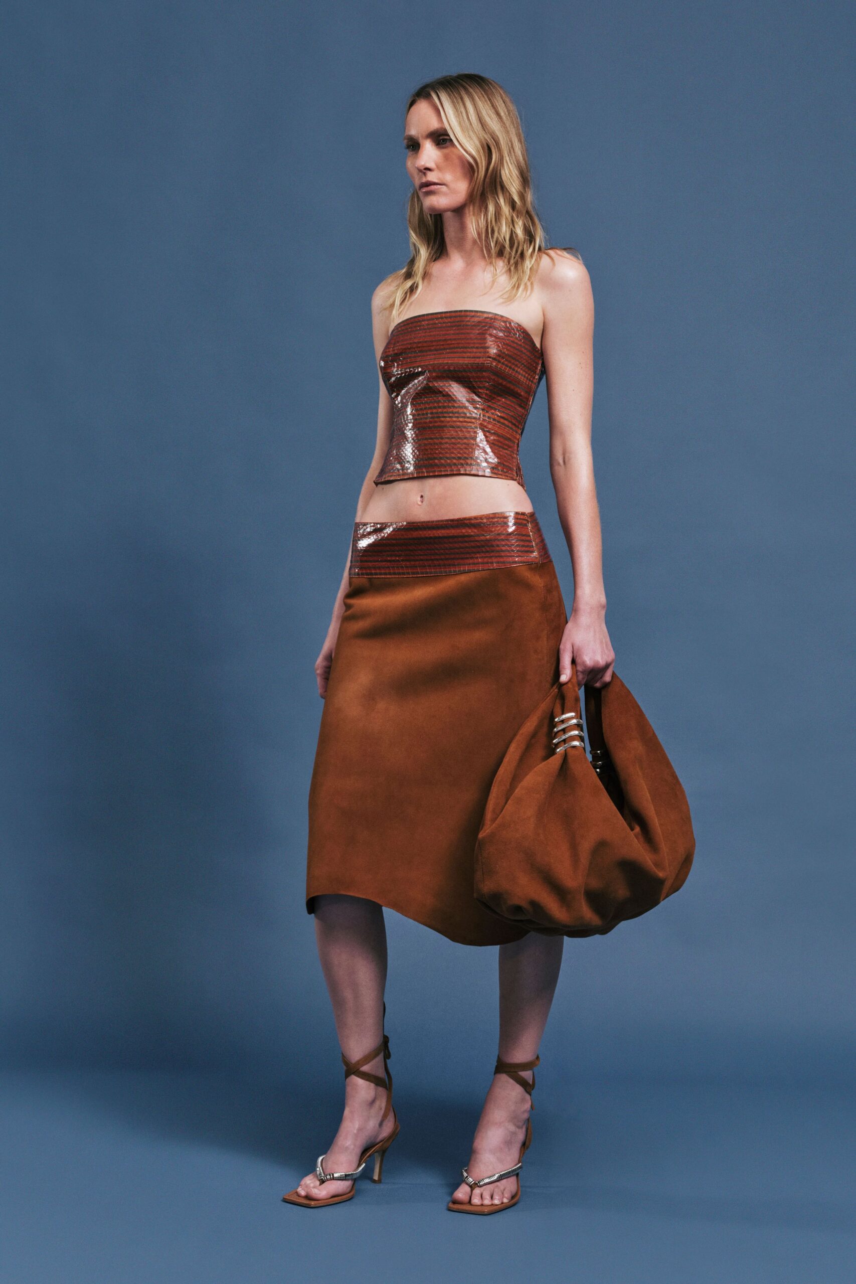 brown leather fitted top and skirt