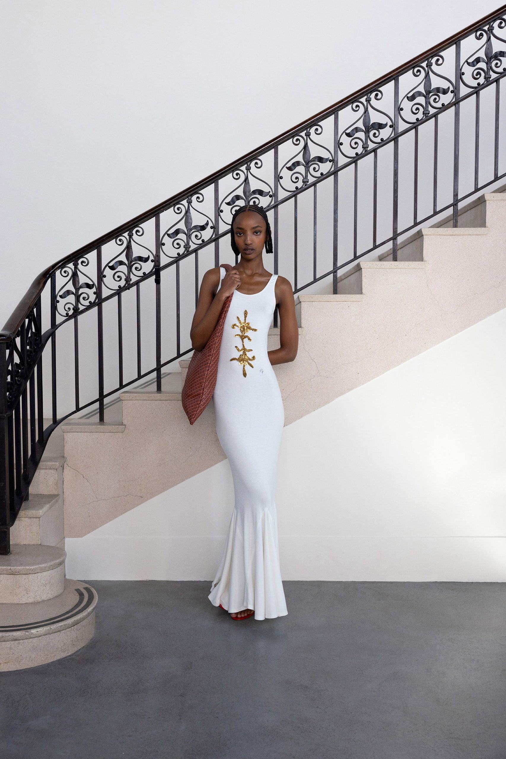 white fitted gown with embroidery