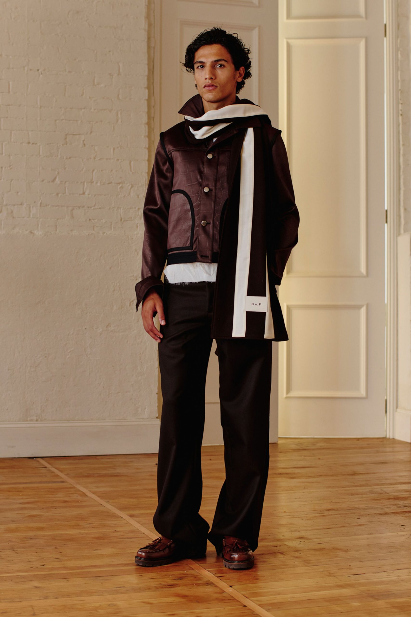 brown leather jacket with white scarf