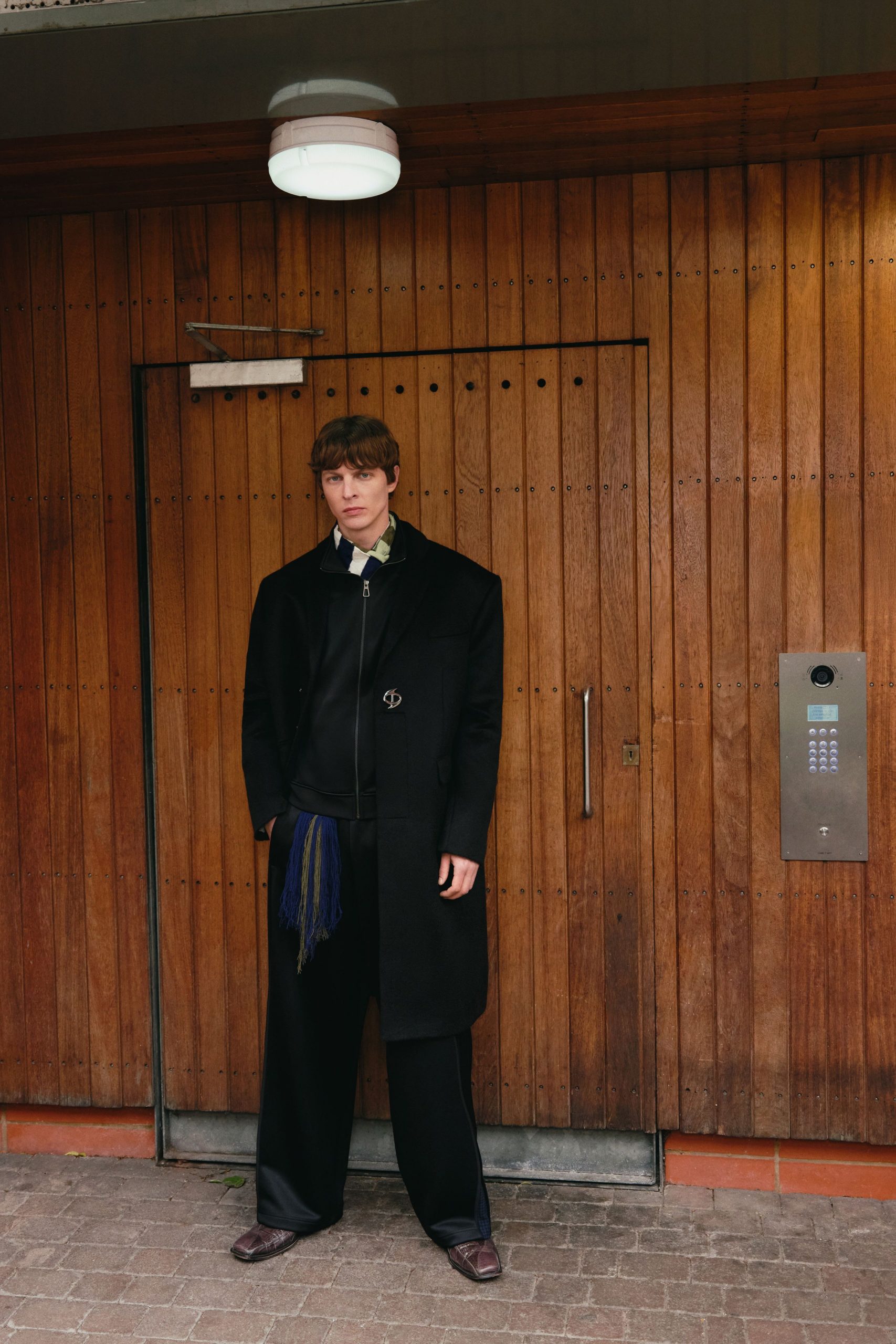 black wool coat with green shirt