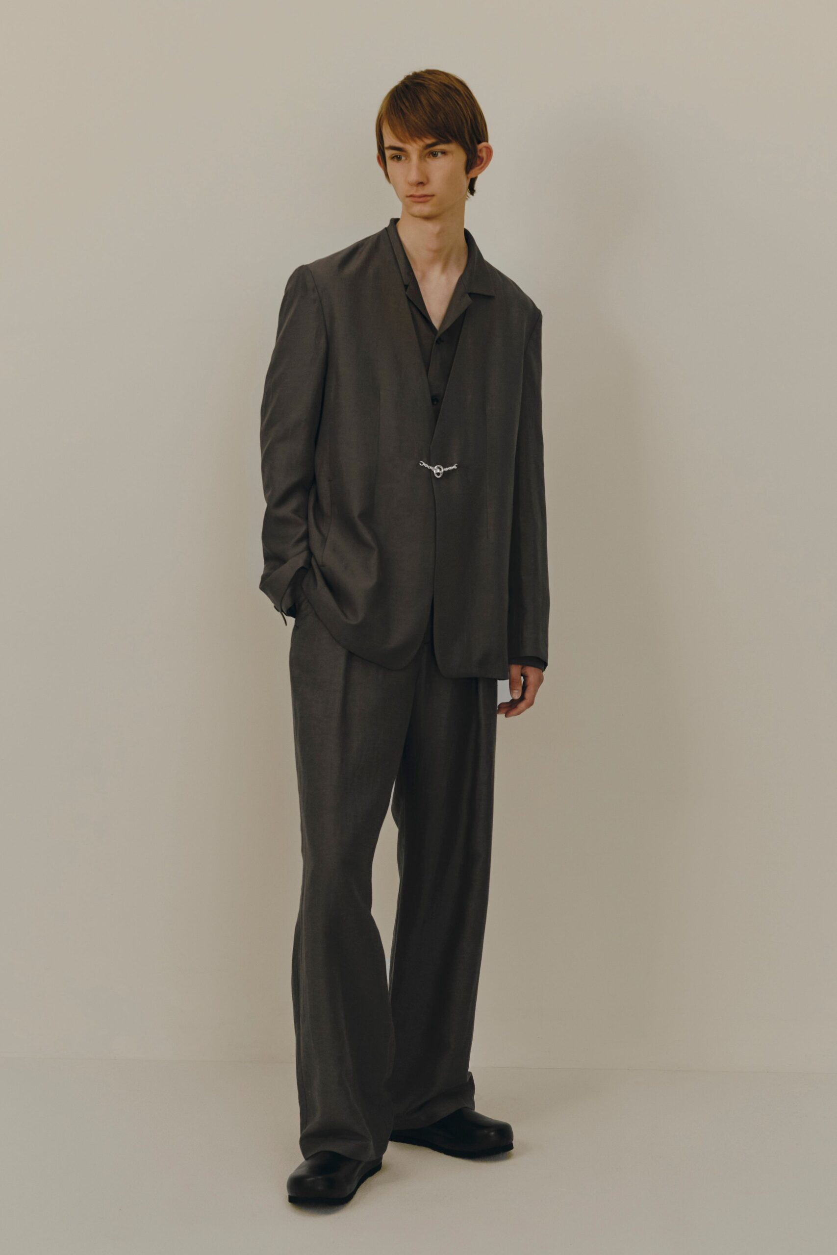 gray relaxed suit with black shirt