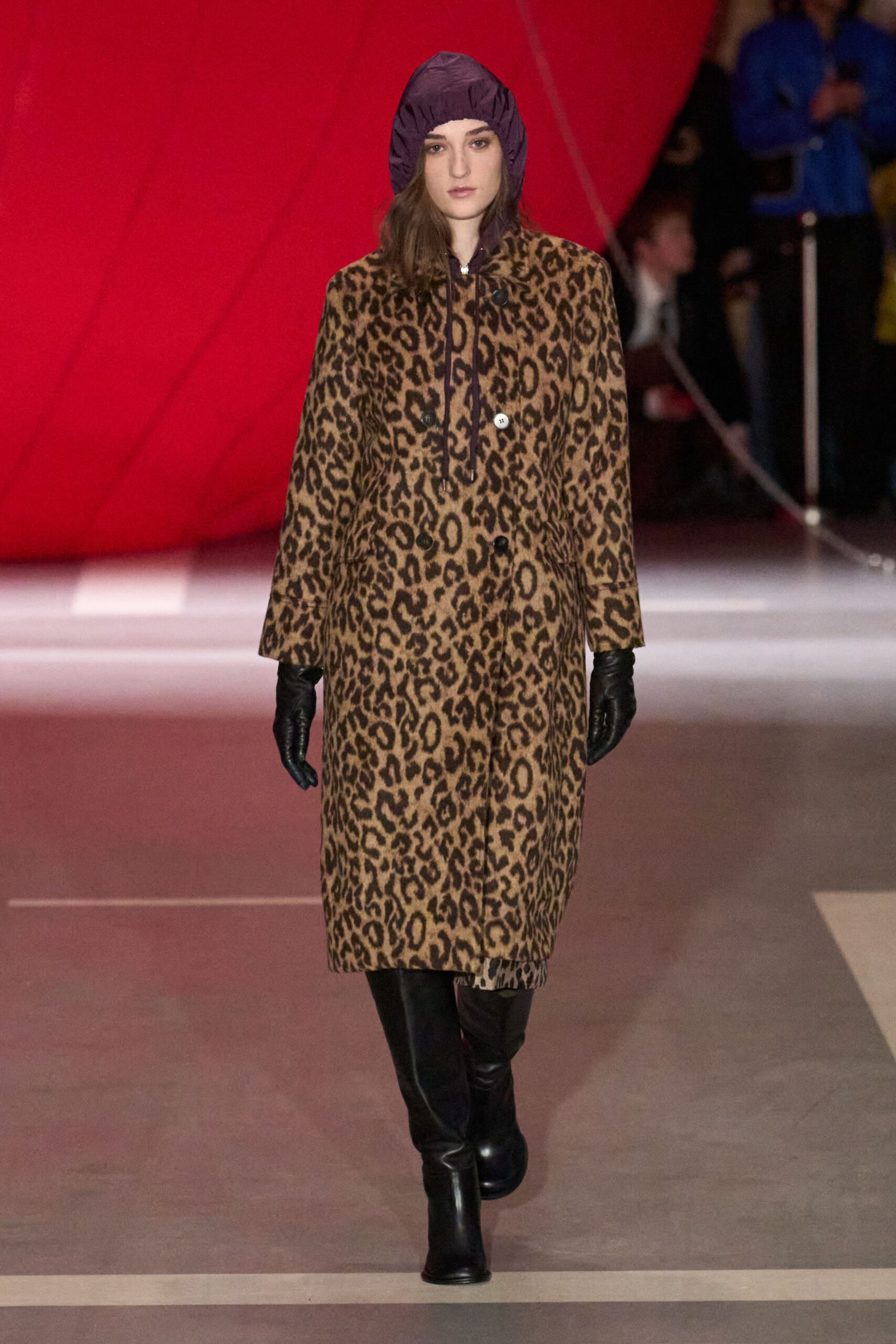 brown animal-print coat with purple hat