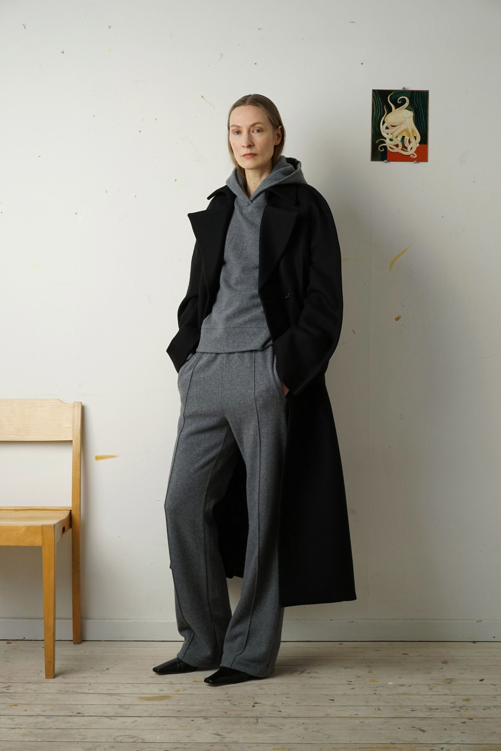 black coat gray hoodie tailored pants