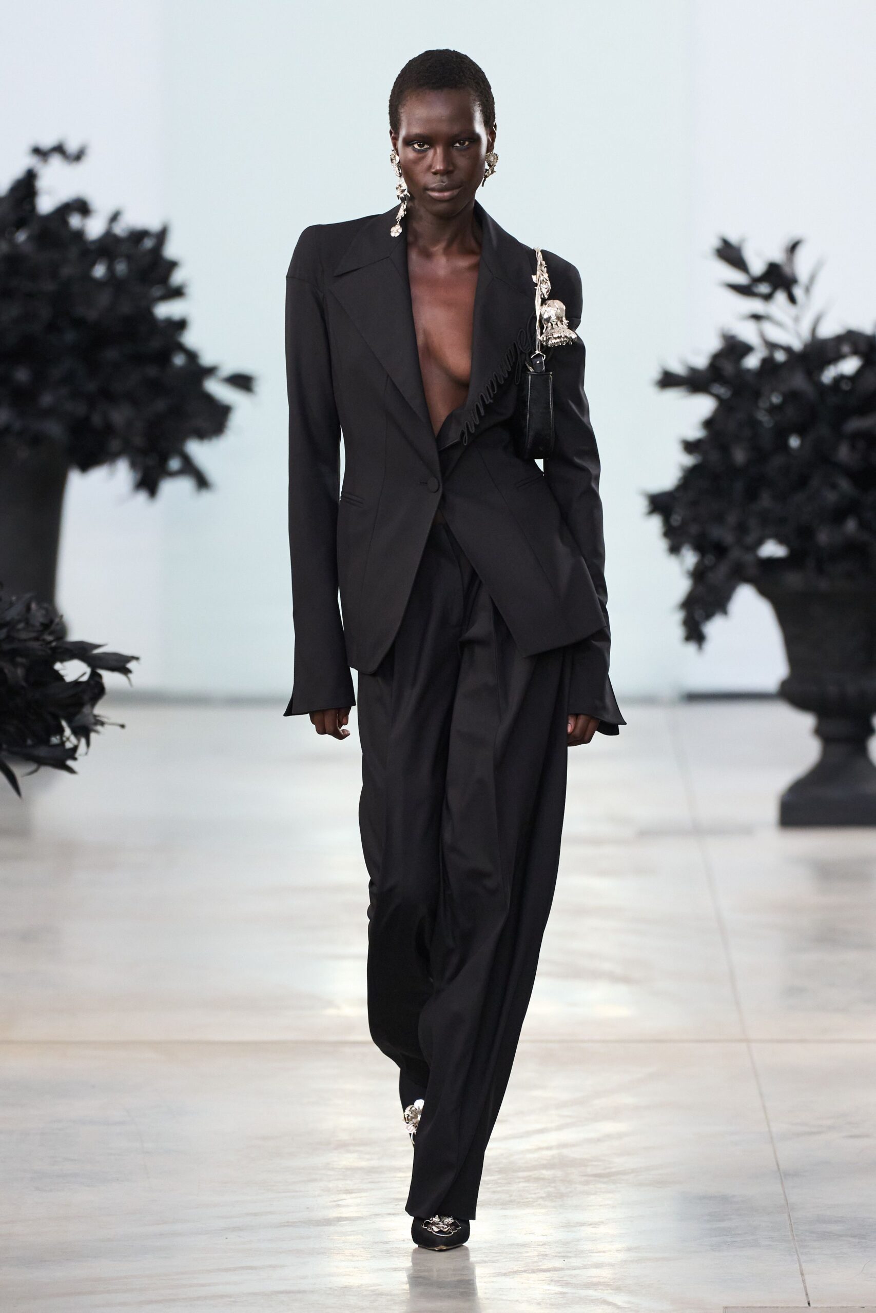 black tailored blazer and relaxed pants