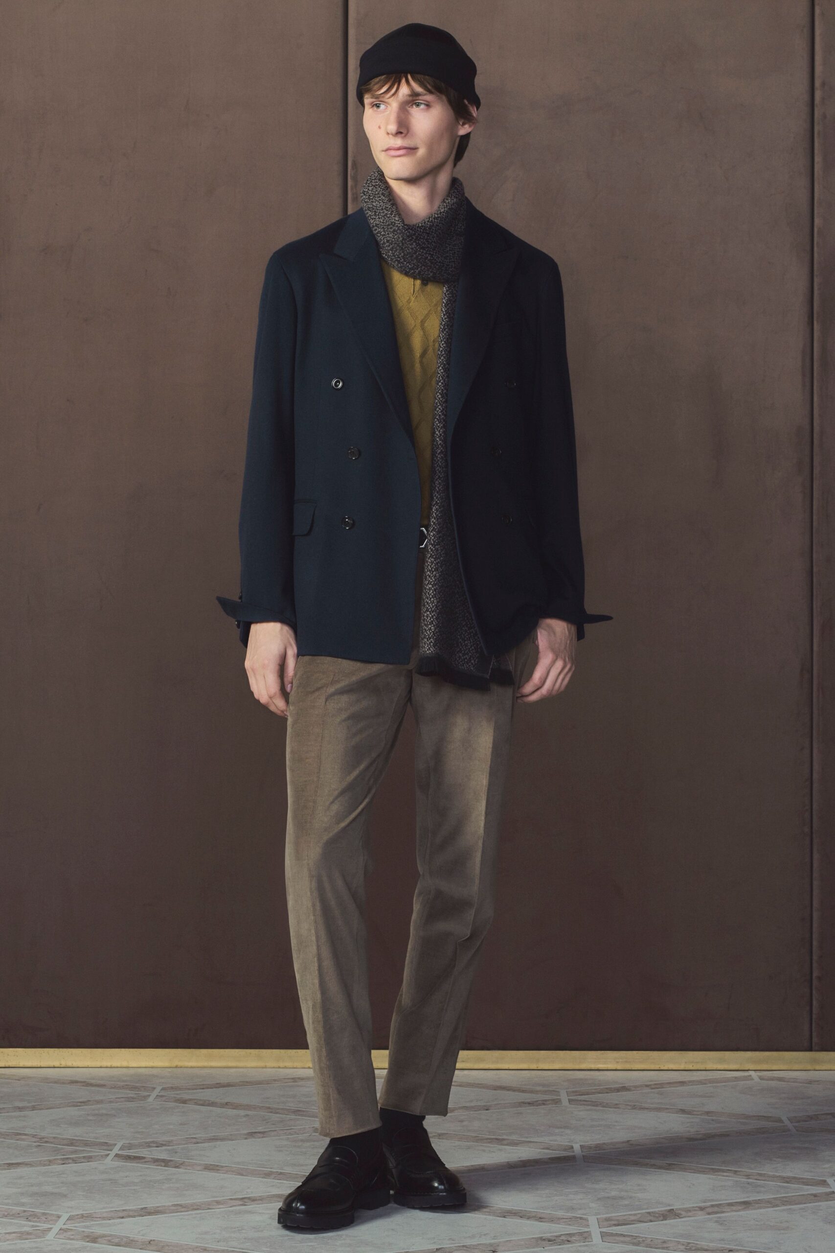black blazer with beige pants