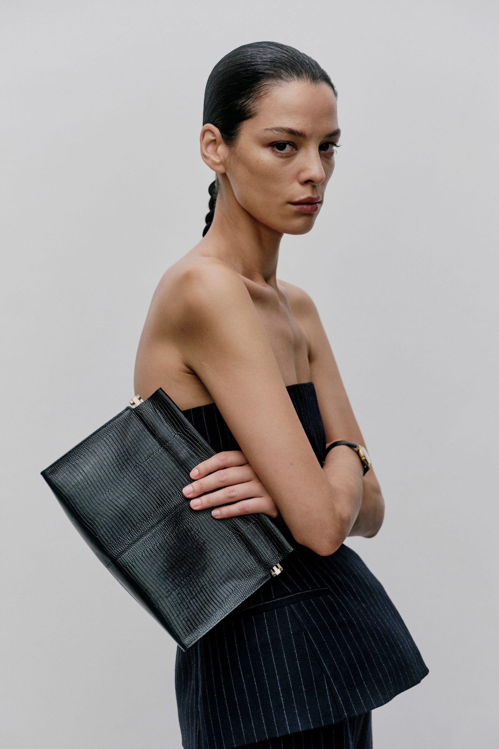 black fitted strapless top with clutch
