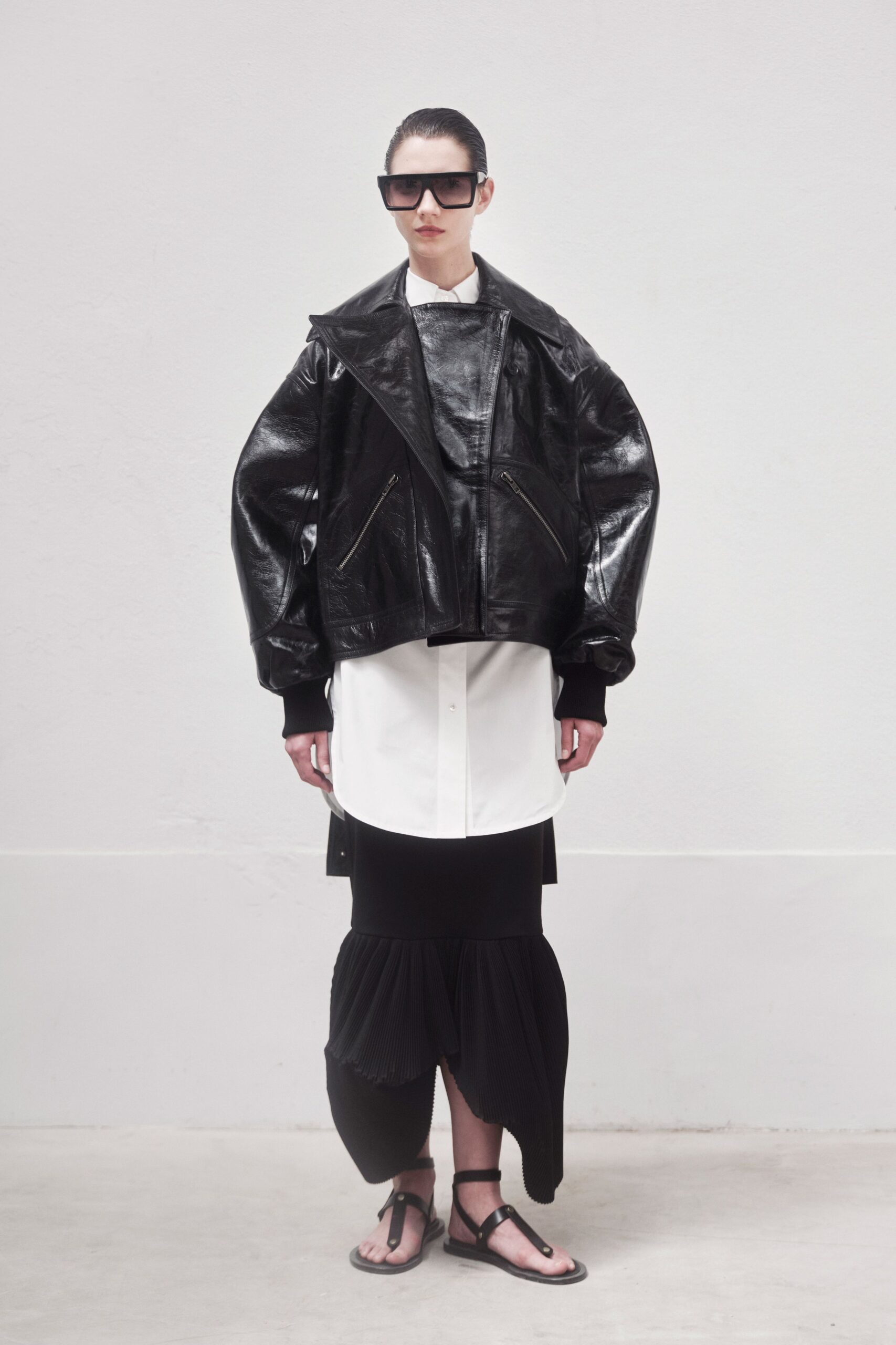 oversized black leather jacket with white shirt