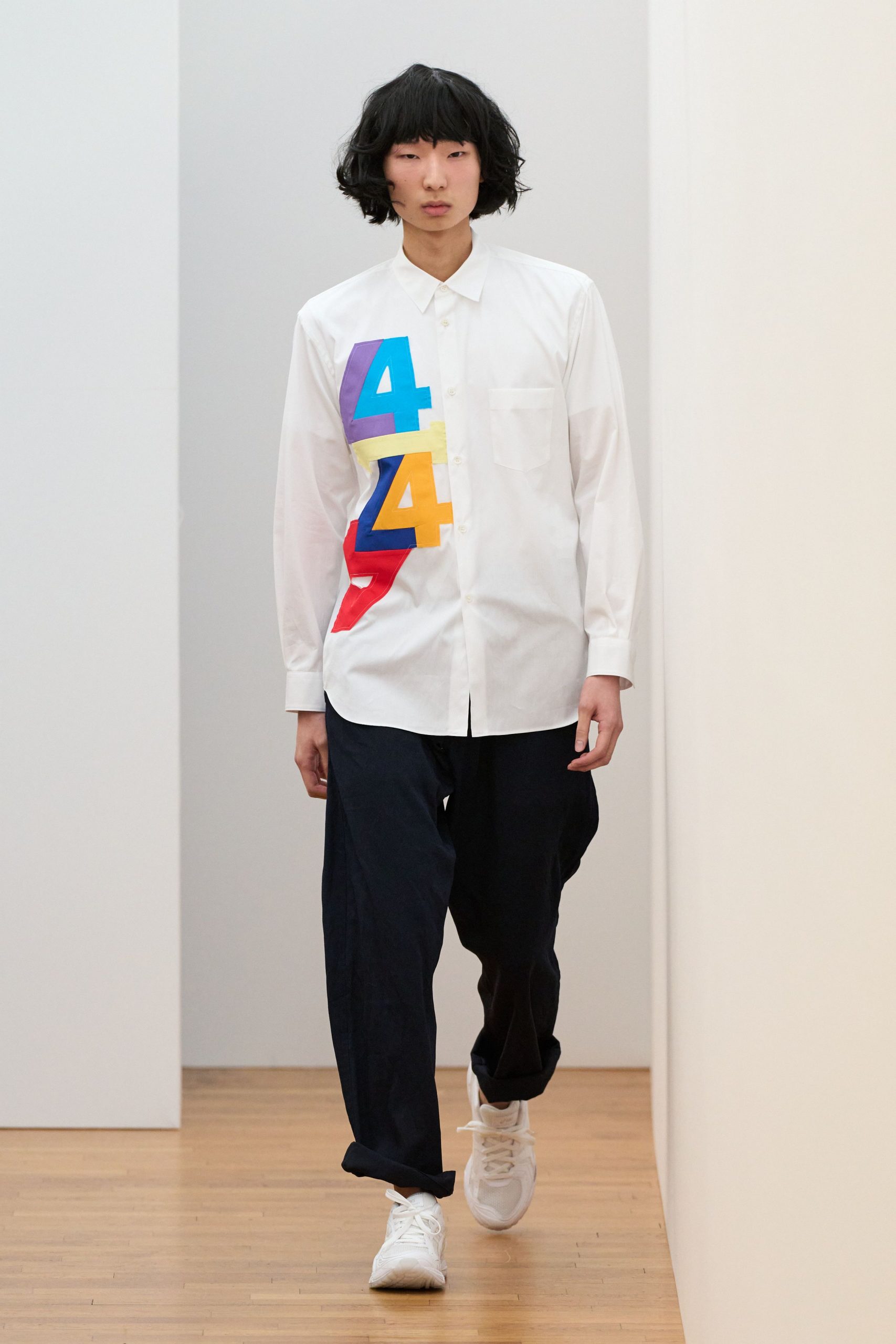 white printed shirt with navy pants