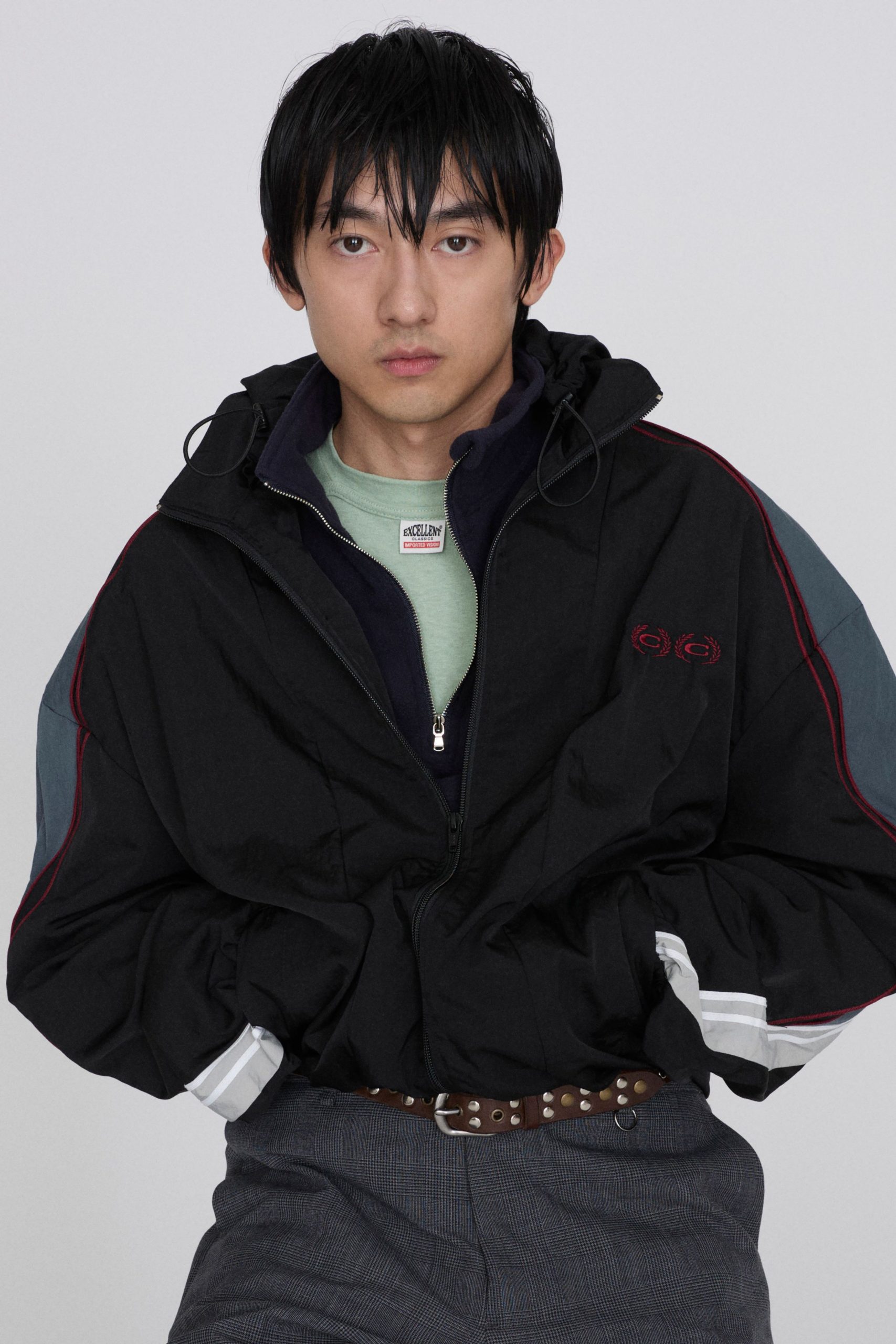 black relaxed jacket with green shirt