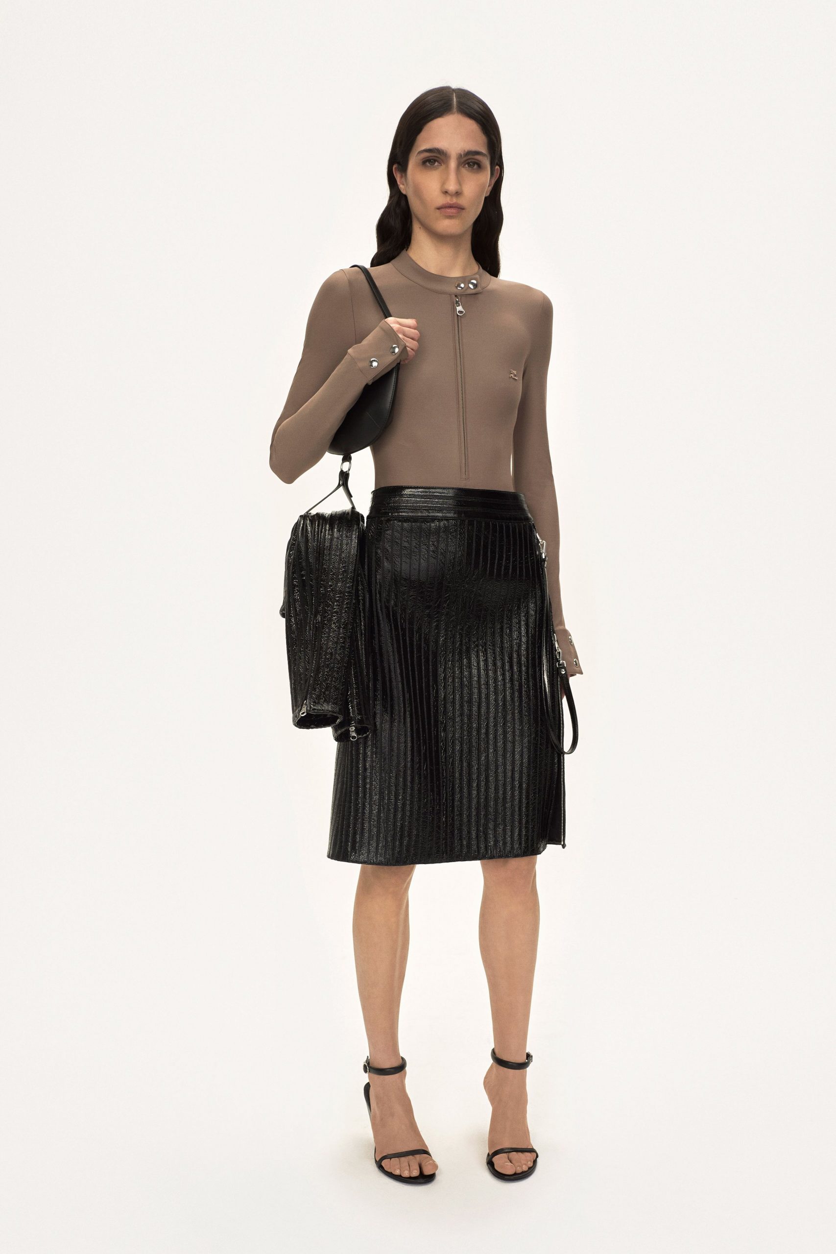beige neoprene bodysuit with black pleated skirt