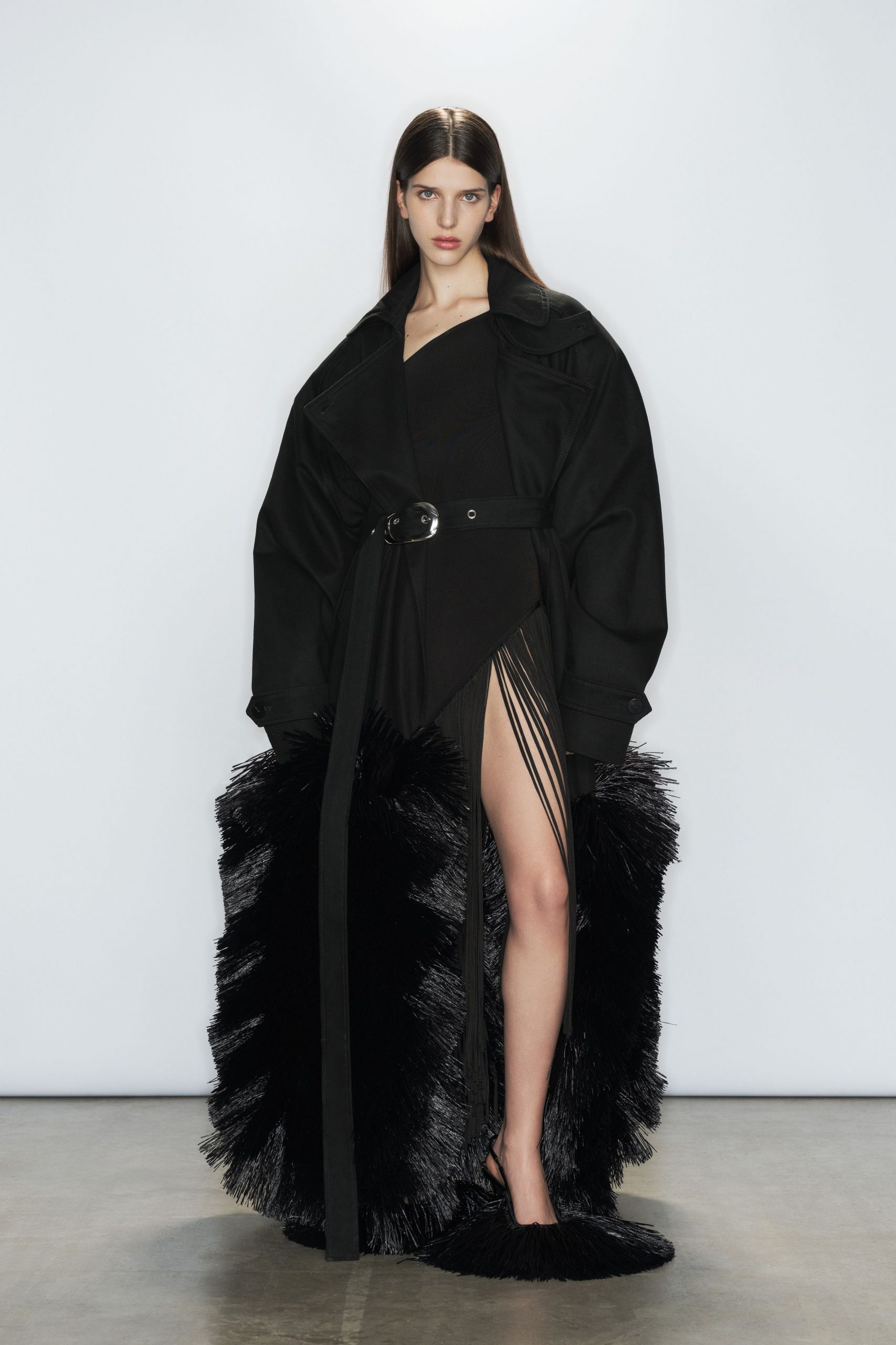 black fitted dress with oversized coat