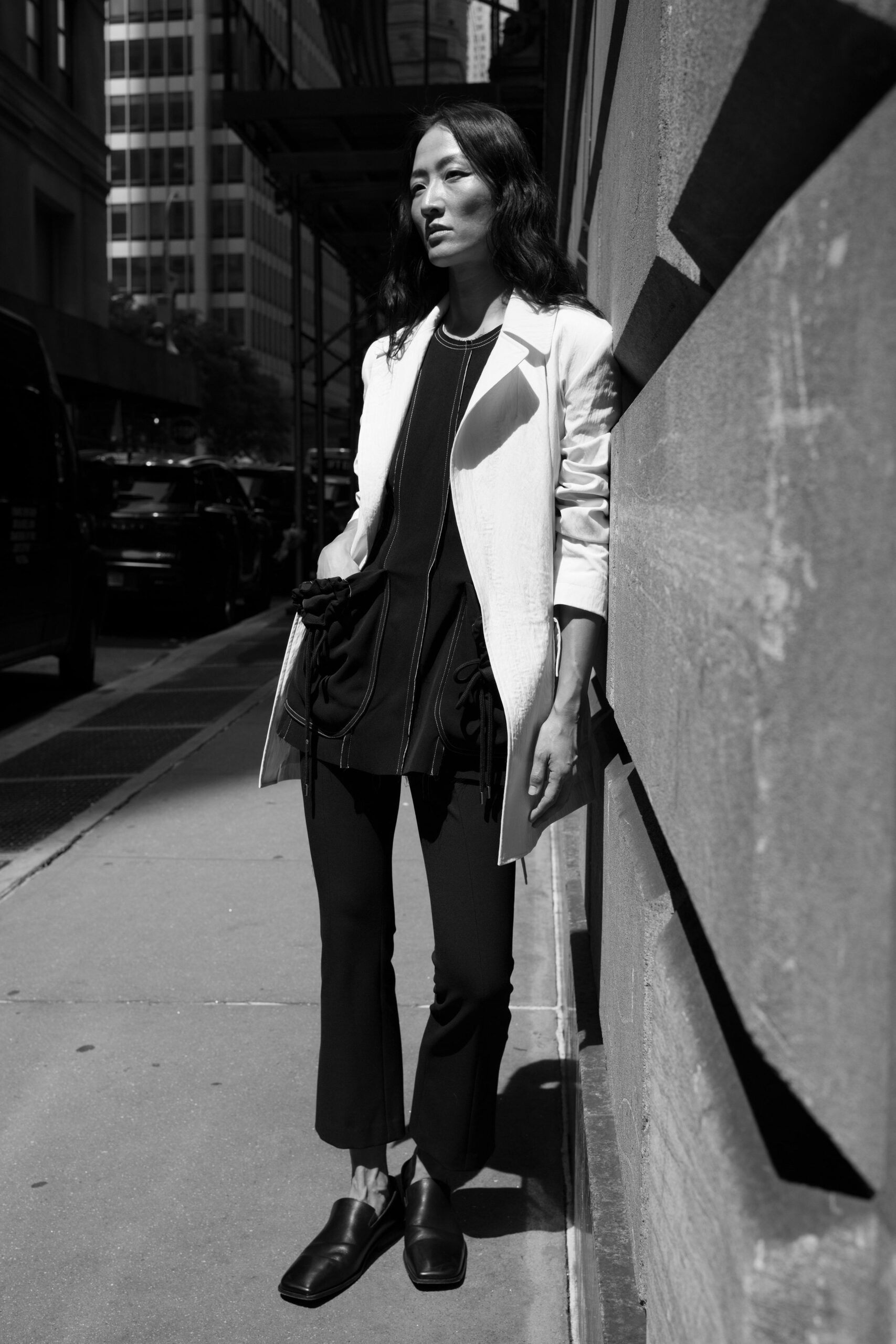 white tailored blazer black top pants