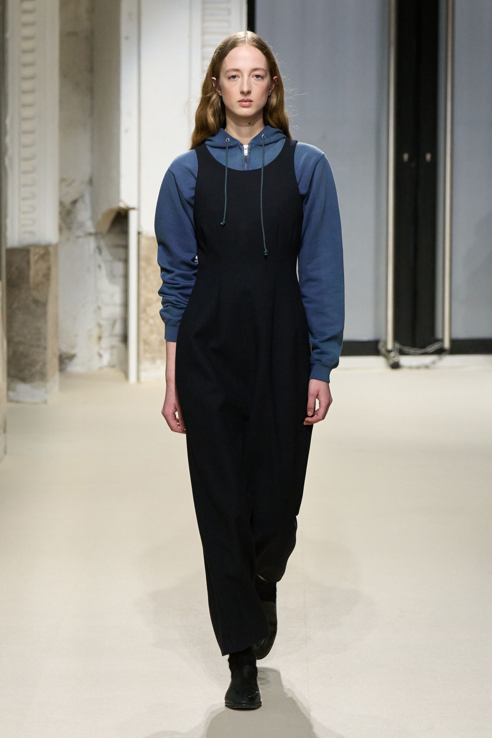 black relaxed jumpsuit with blue hoodie