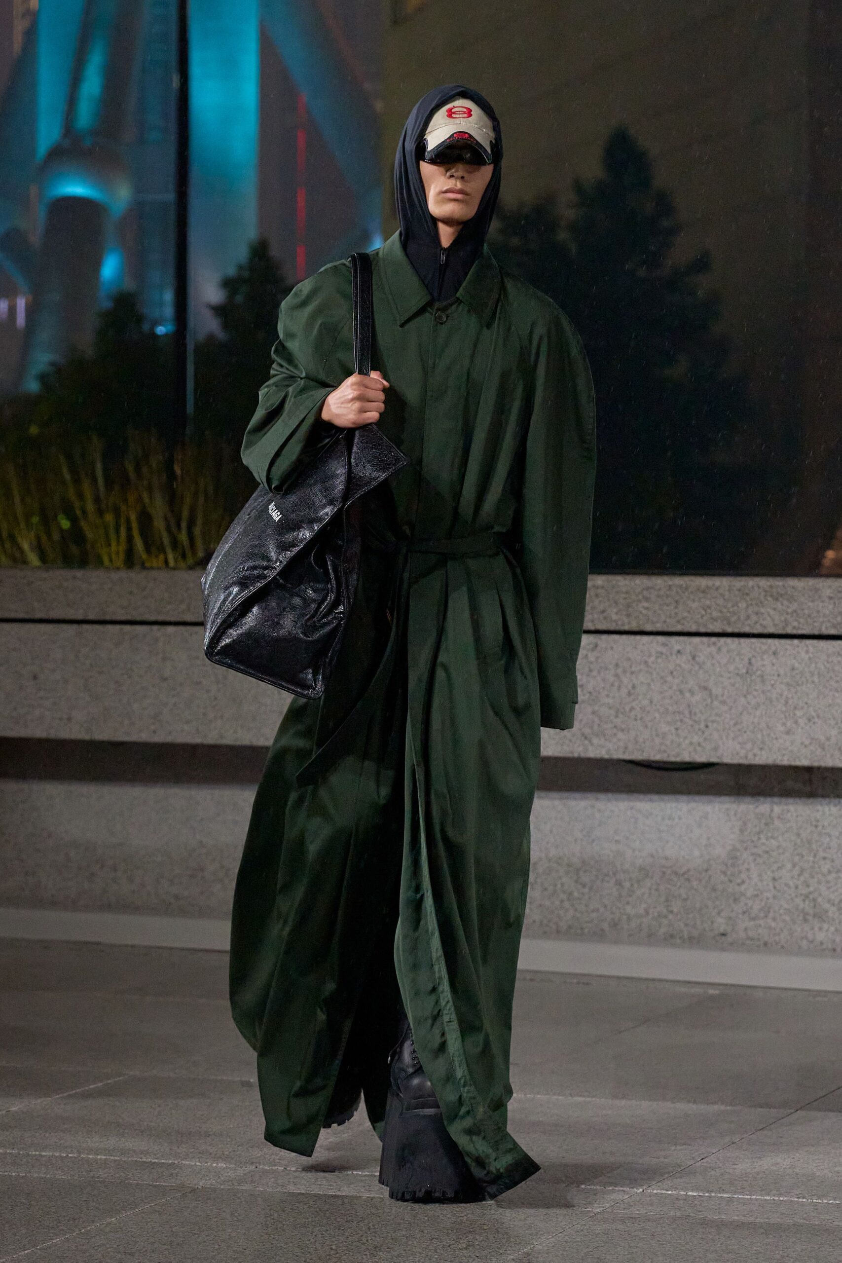 green relaxed coat with black accessories