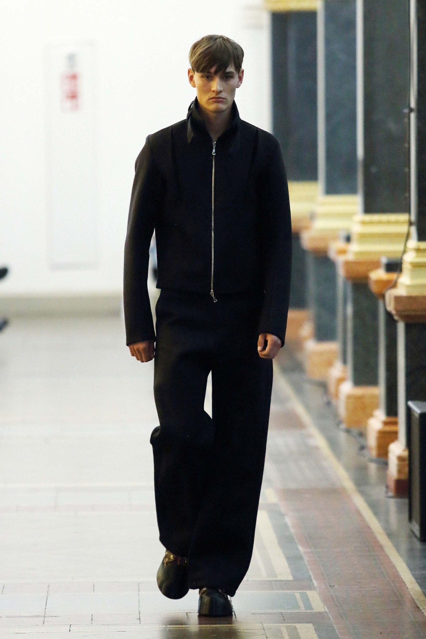 black structured jacket and relaxed pants
