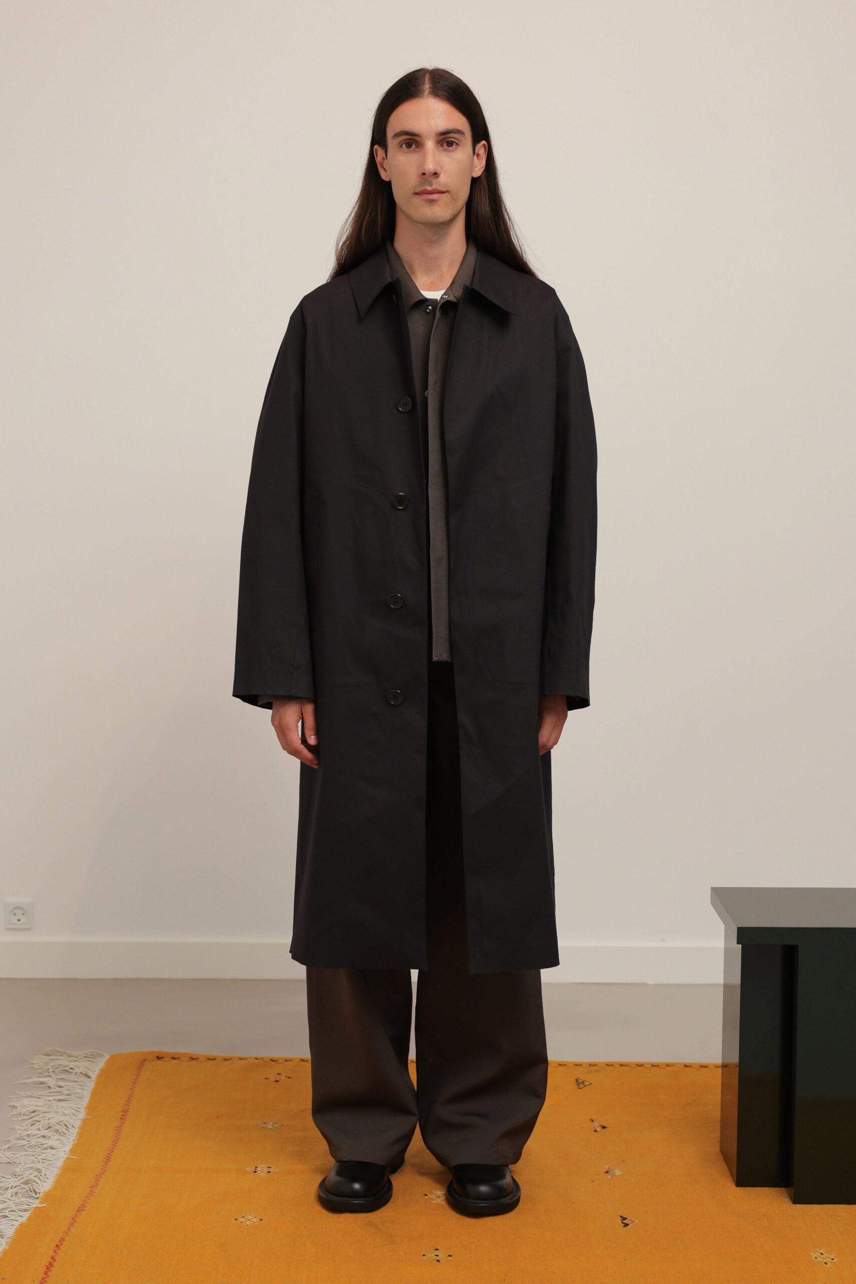 black cotton long-sleeve collared oversized buttoned straight-leg coat