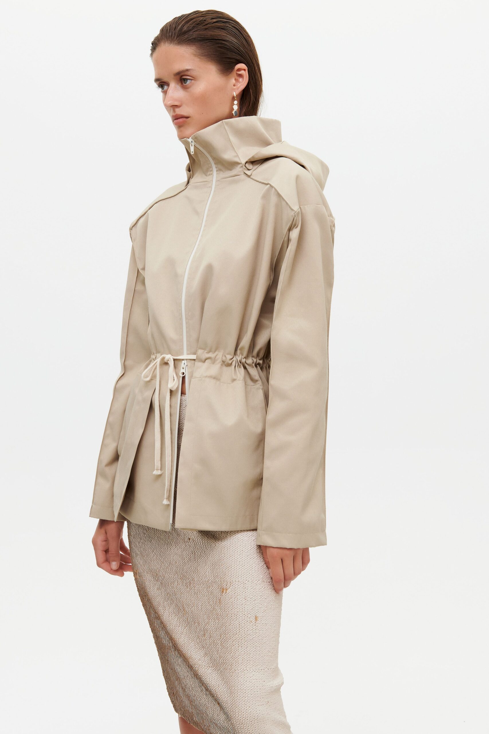 beige hooded jacket and white skirt