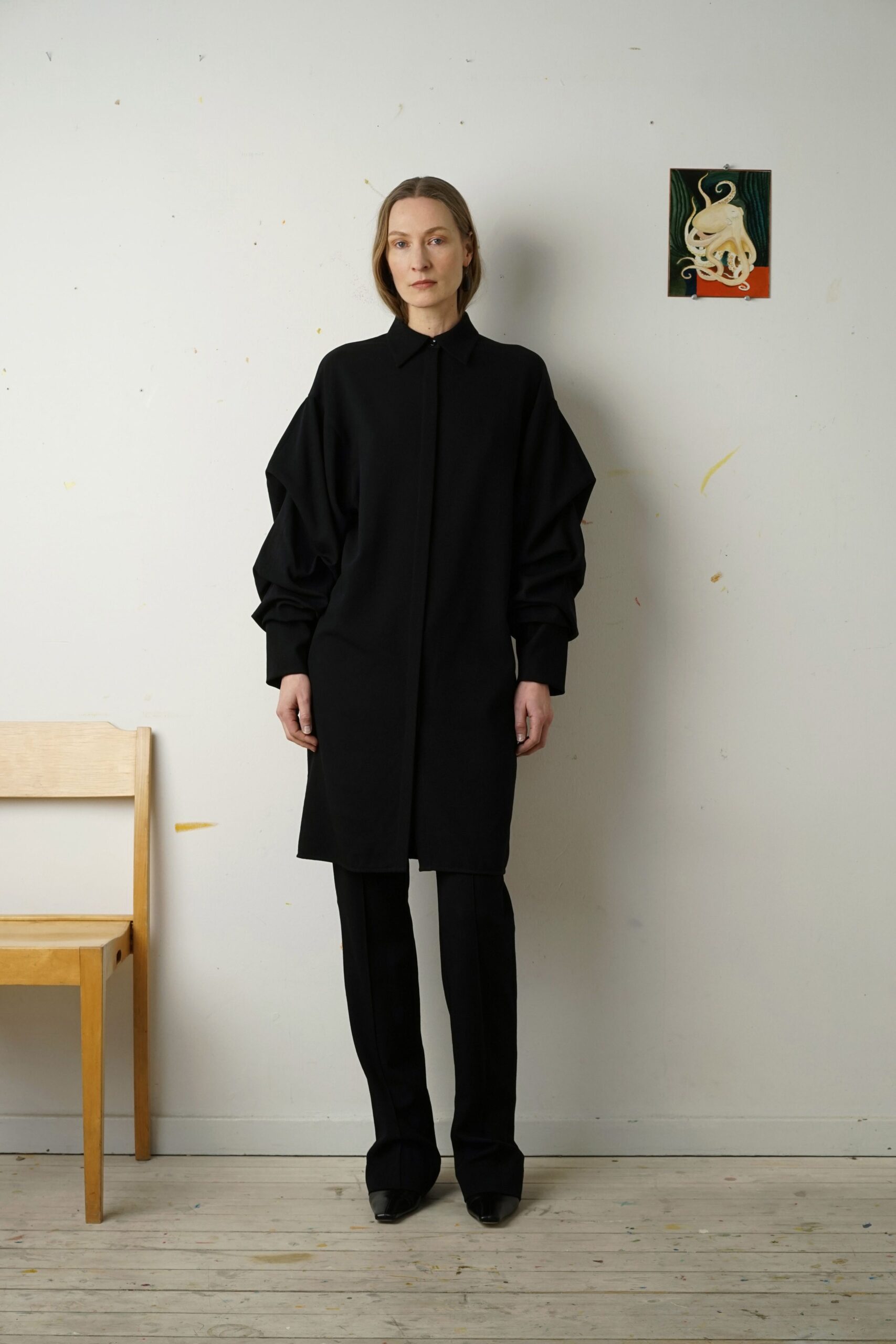 black relaxed coat with slim pants