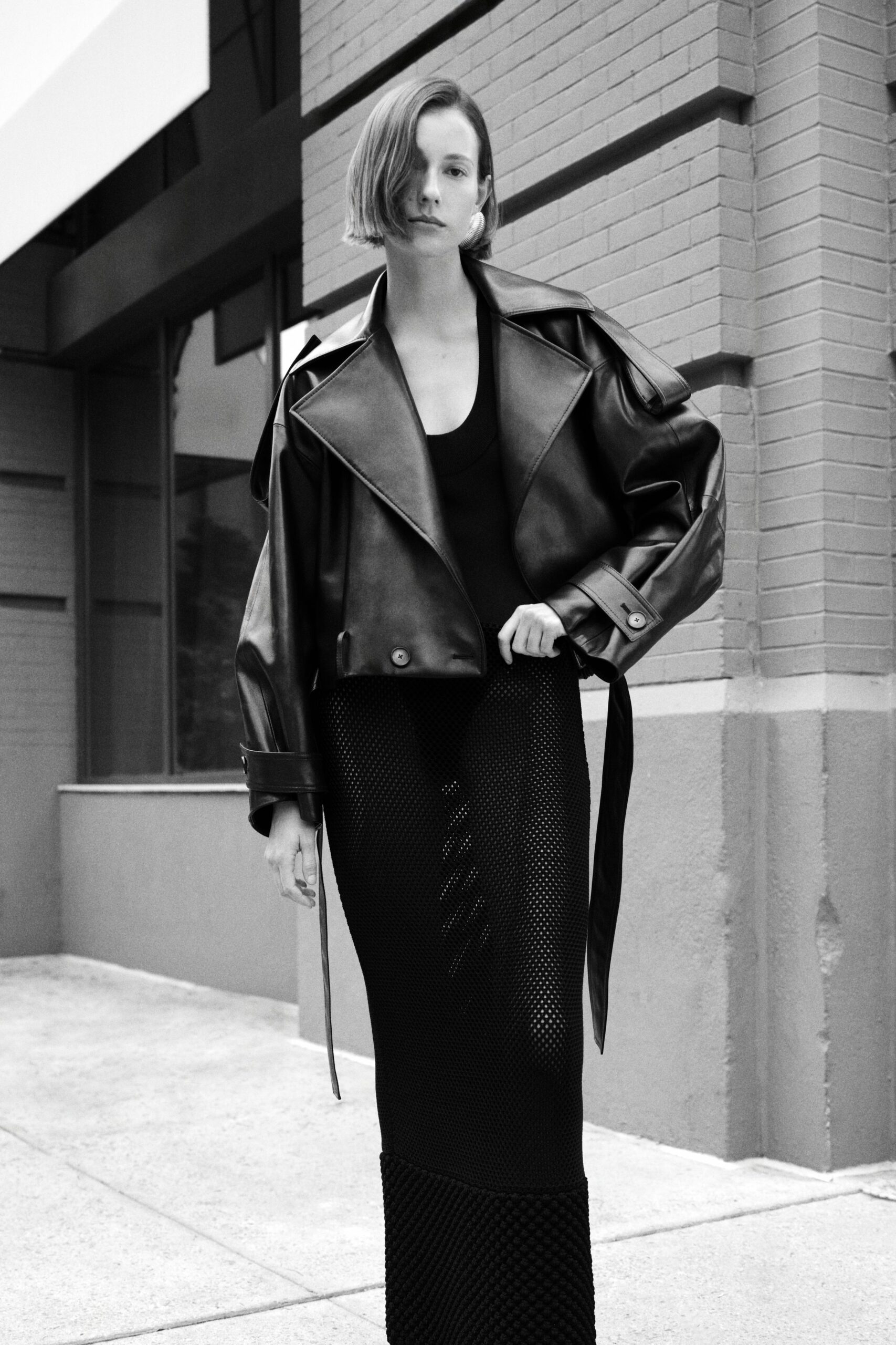 black leather long-sleeve collared oversized pockets belted jacket
