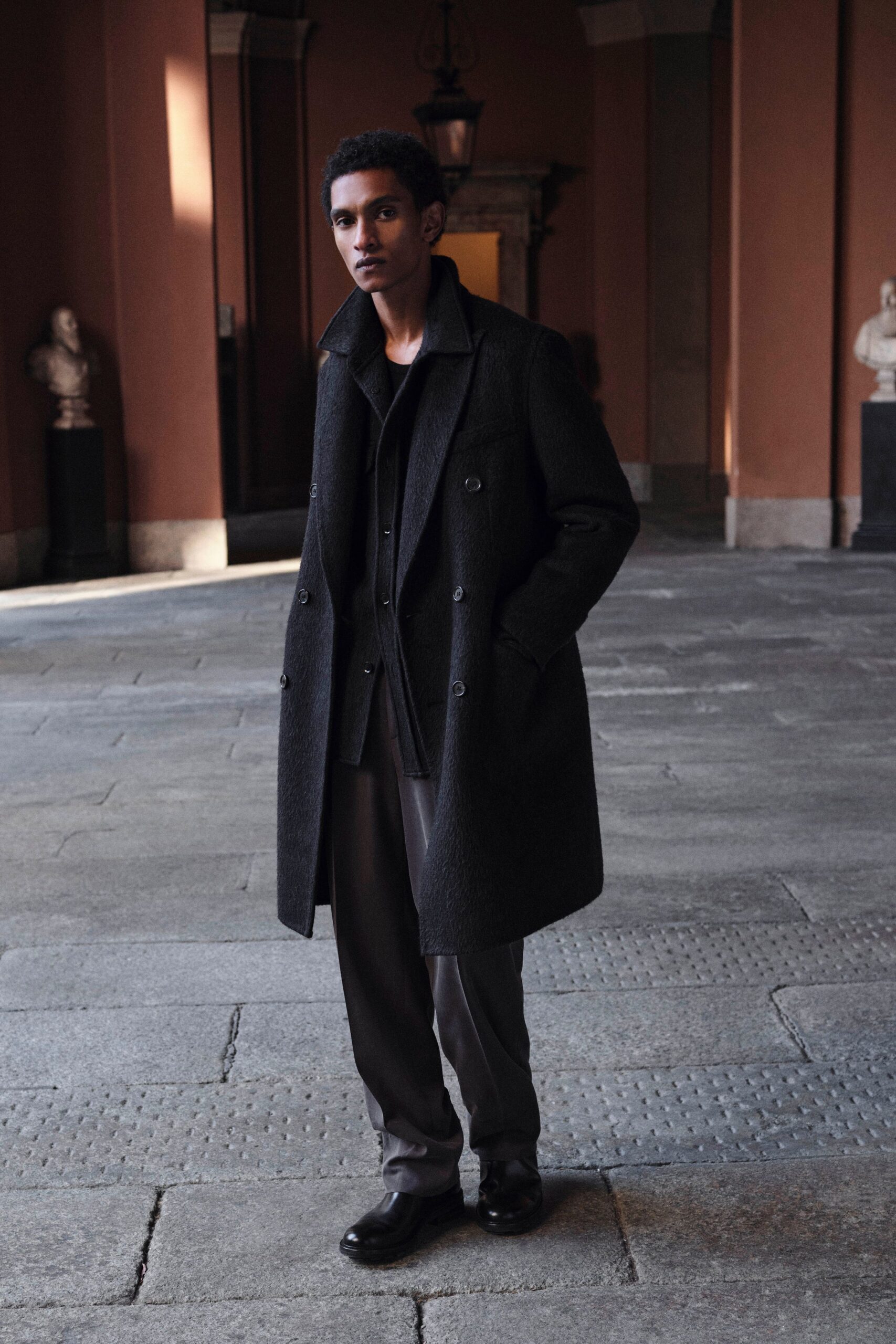 black wool long-sleeve collared structured buttoned coat